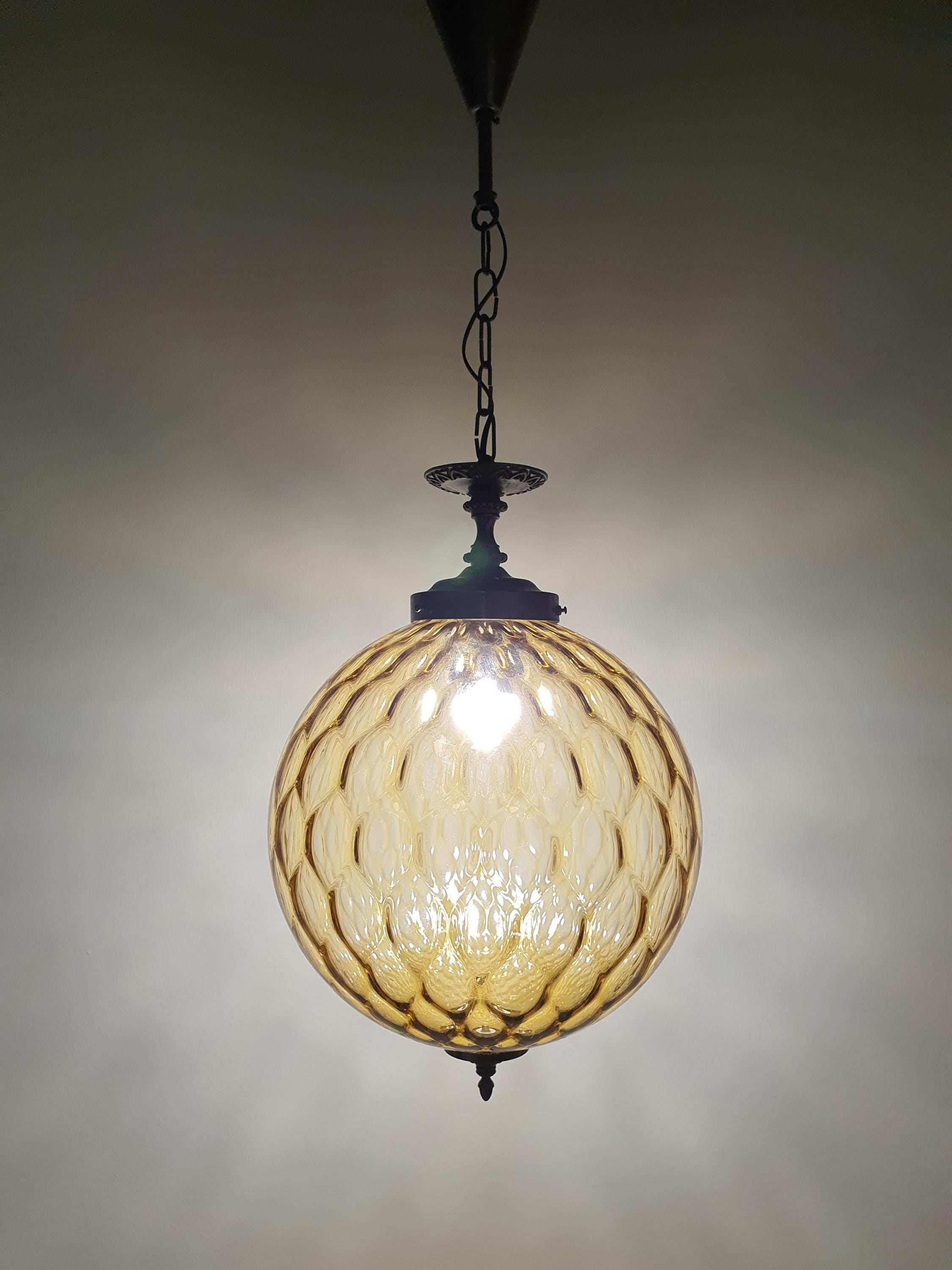 Detail of brass fitting patina and oxidation, vintage Murano honeycomb globe pendant