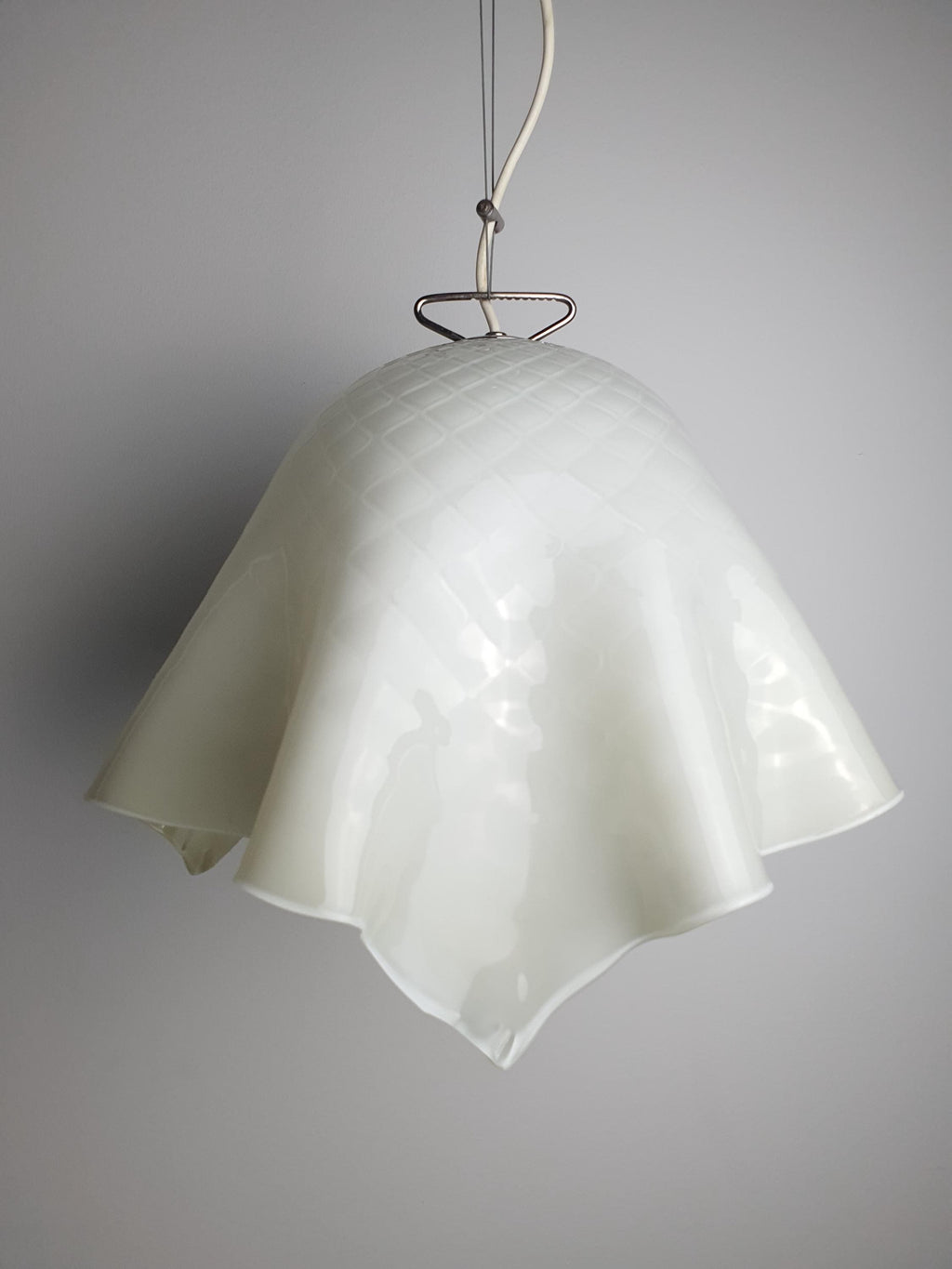 Flowing handkerchief-shaped green glass shade on a vintage Murano pendant
