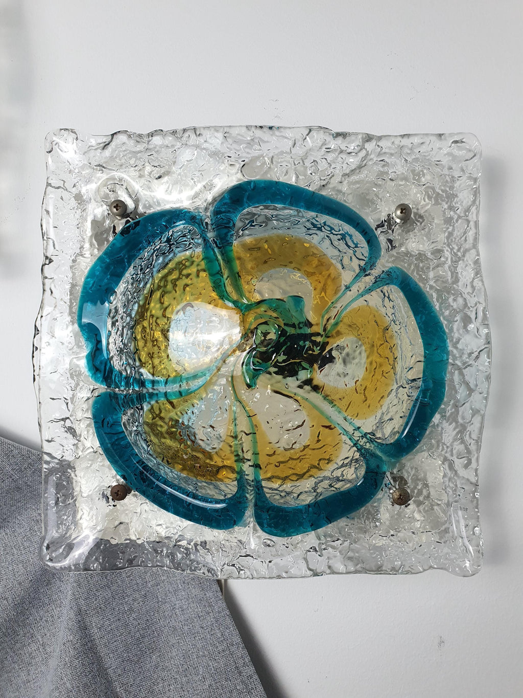Mazzega Murano floral sconce front view, thick irregular turquoise and caramel glass petals, white painted metal base