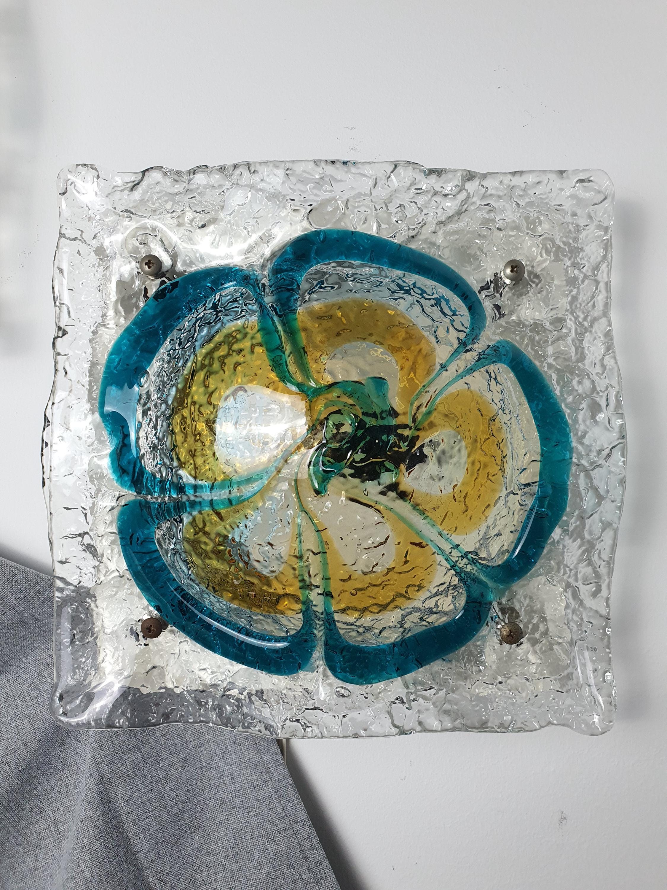 Mazzega Murano floral sconce front view, thick irregular turquoise and caramel glass petals, white painted metal base