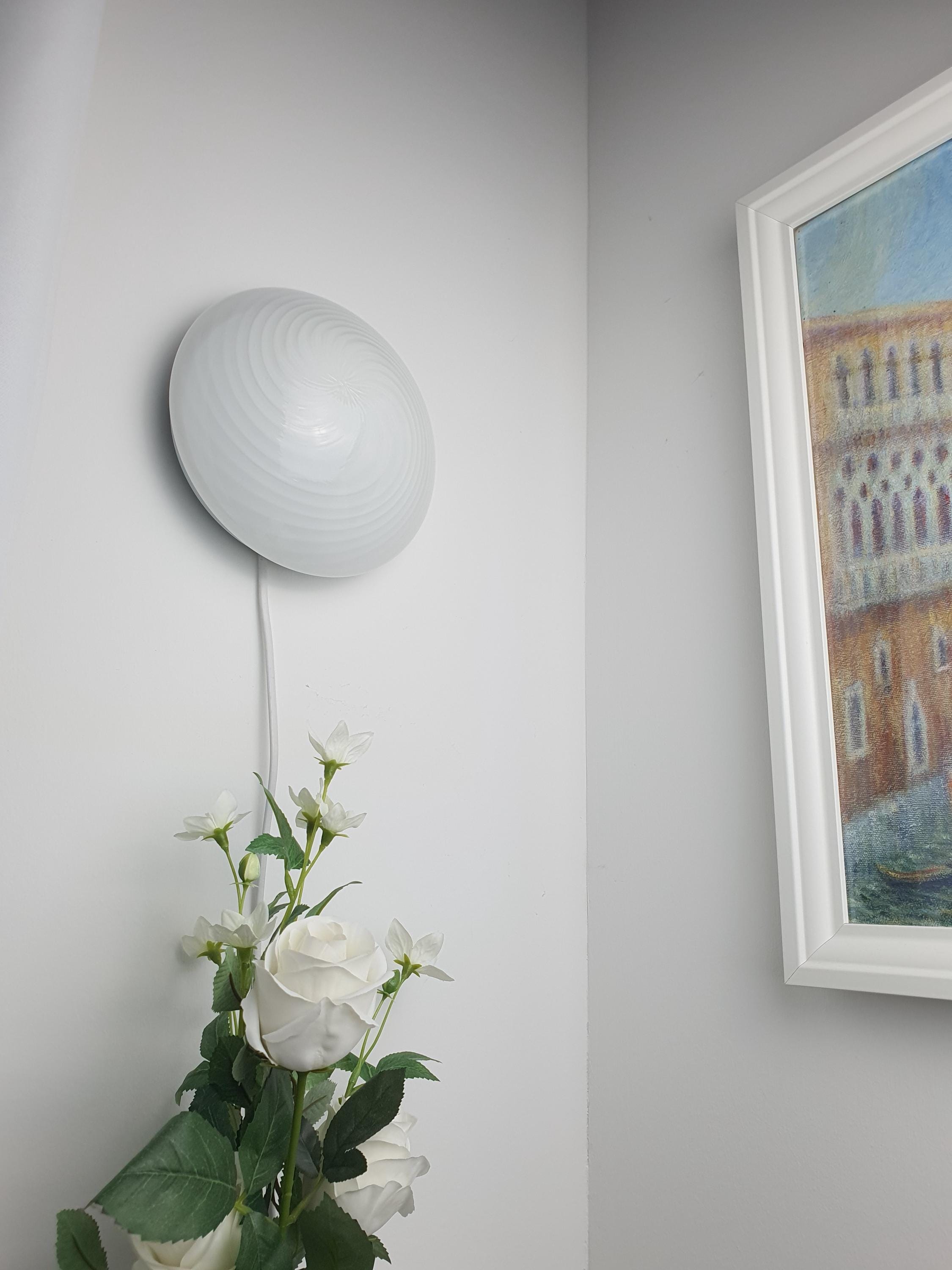 Underside view of vintage Murano white swirl glass flush mount, E27 socket