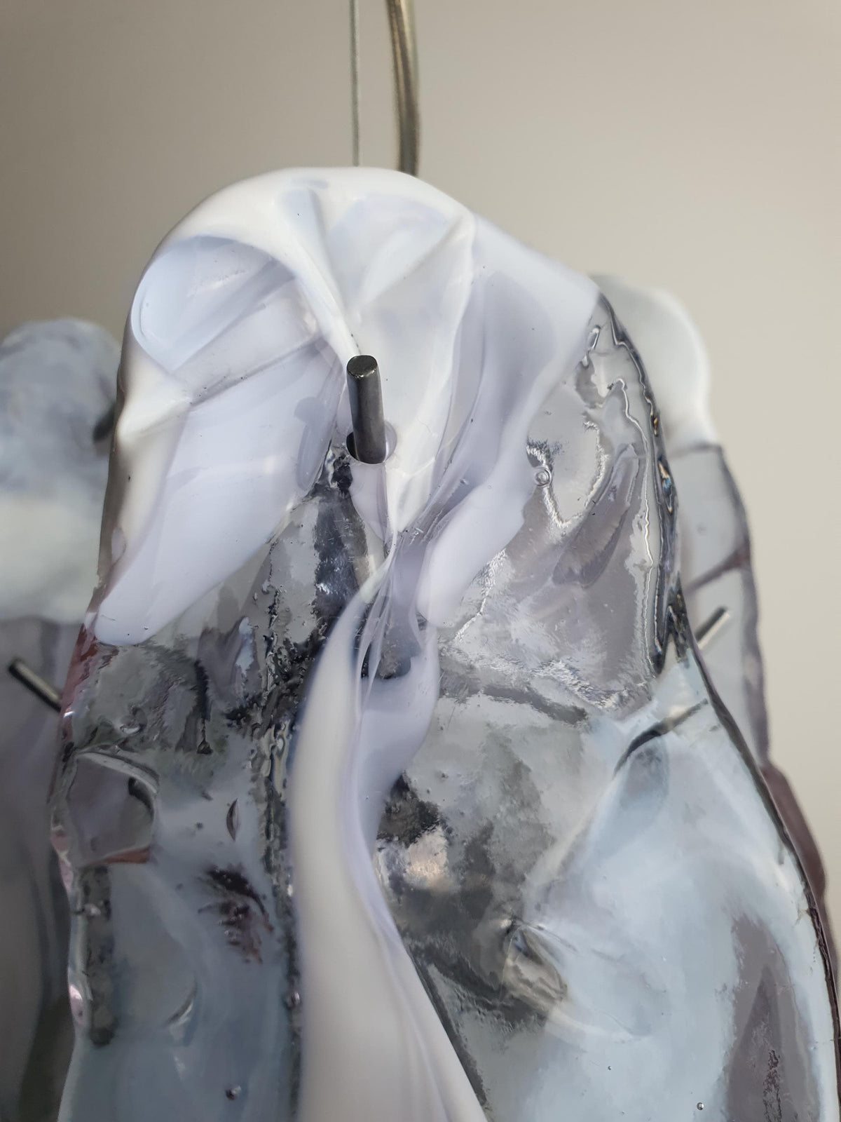 Clear hand-blown glass petal with delicate white spots
