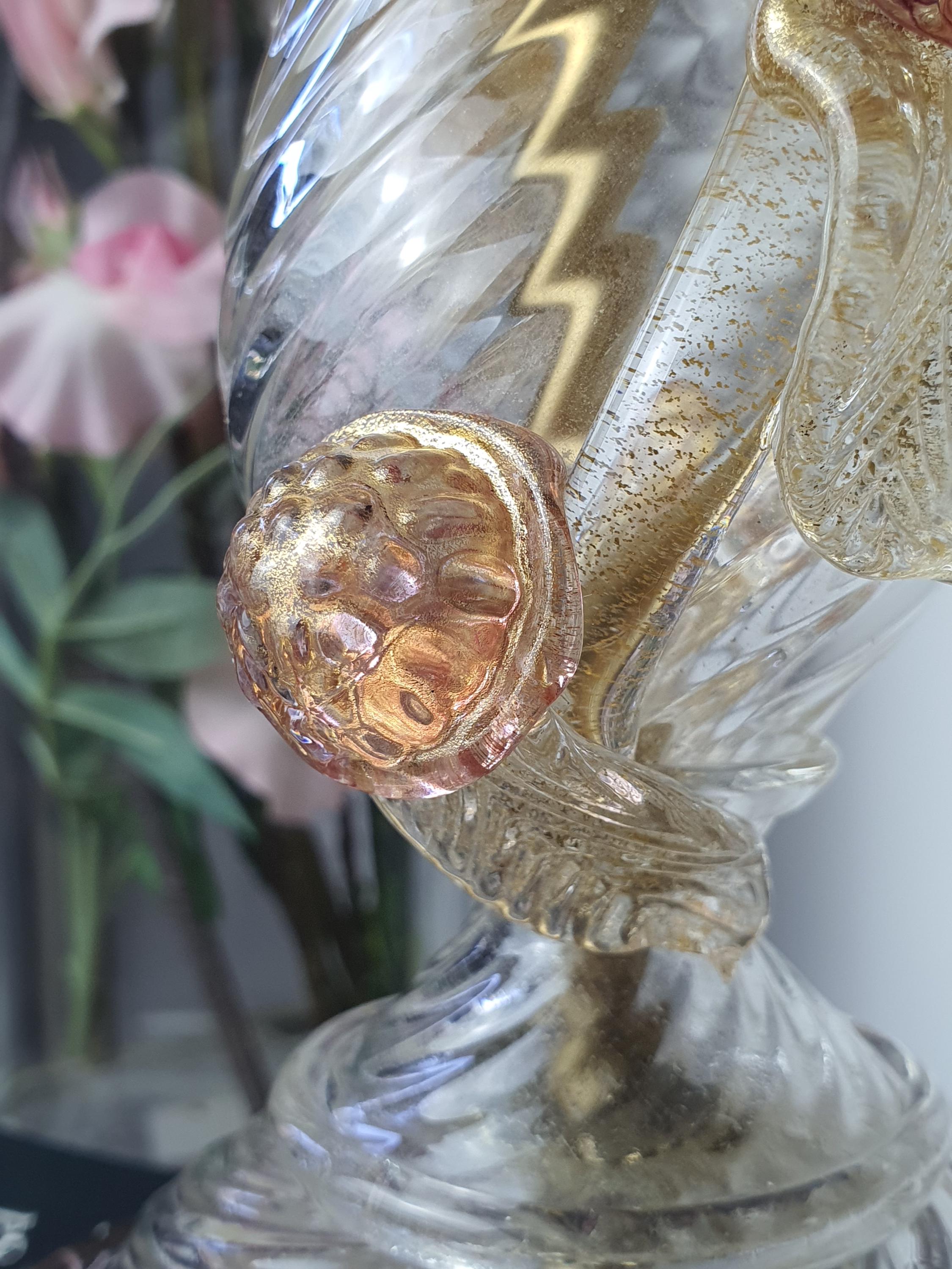 Close-up of aventurine gold flakes and pink accents on vintage Murano glass bedside lamp, sparkling gold inclusions detail