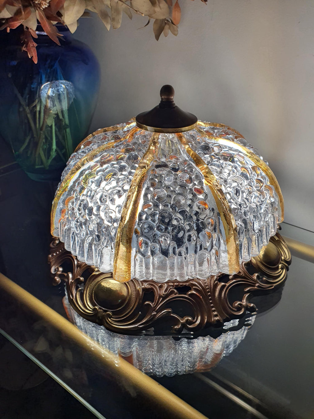 Vintage Art Deco ceiling light with stamped iridescent glass shade on brass base