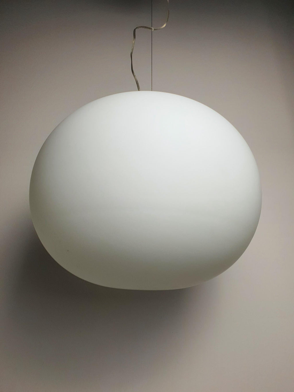 Large vintage globe pendant — dining table setting, warm ambient illumination