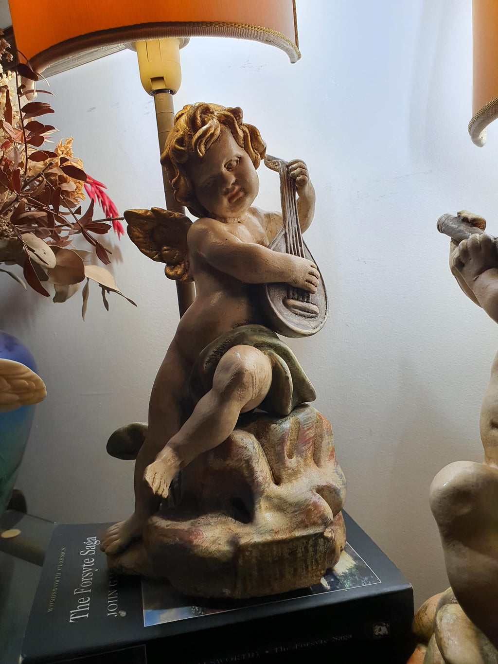 Pair of Florentine cherub angel lamps on bedside tables, matching set, warm romantic glow, classical interior