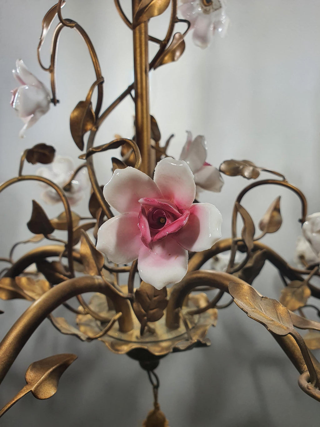 White porcelain roses with soft pink gradients on a vintage Vanotti chandelier
