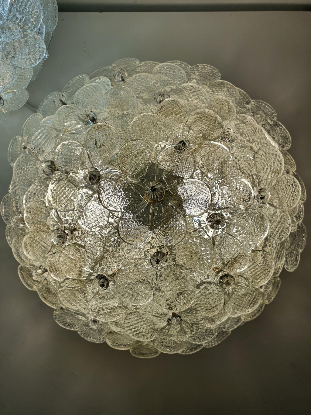 Vintage Murano glass ceiling fixture — millefiori floral pattern illuminated, warm gold glow