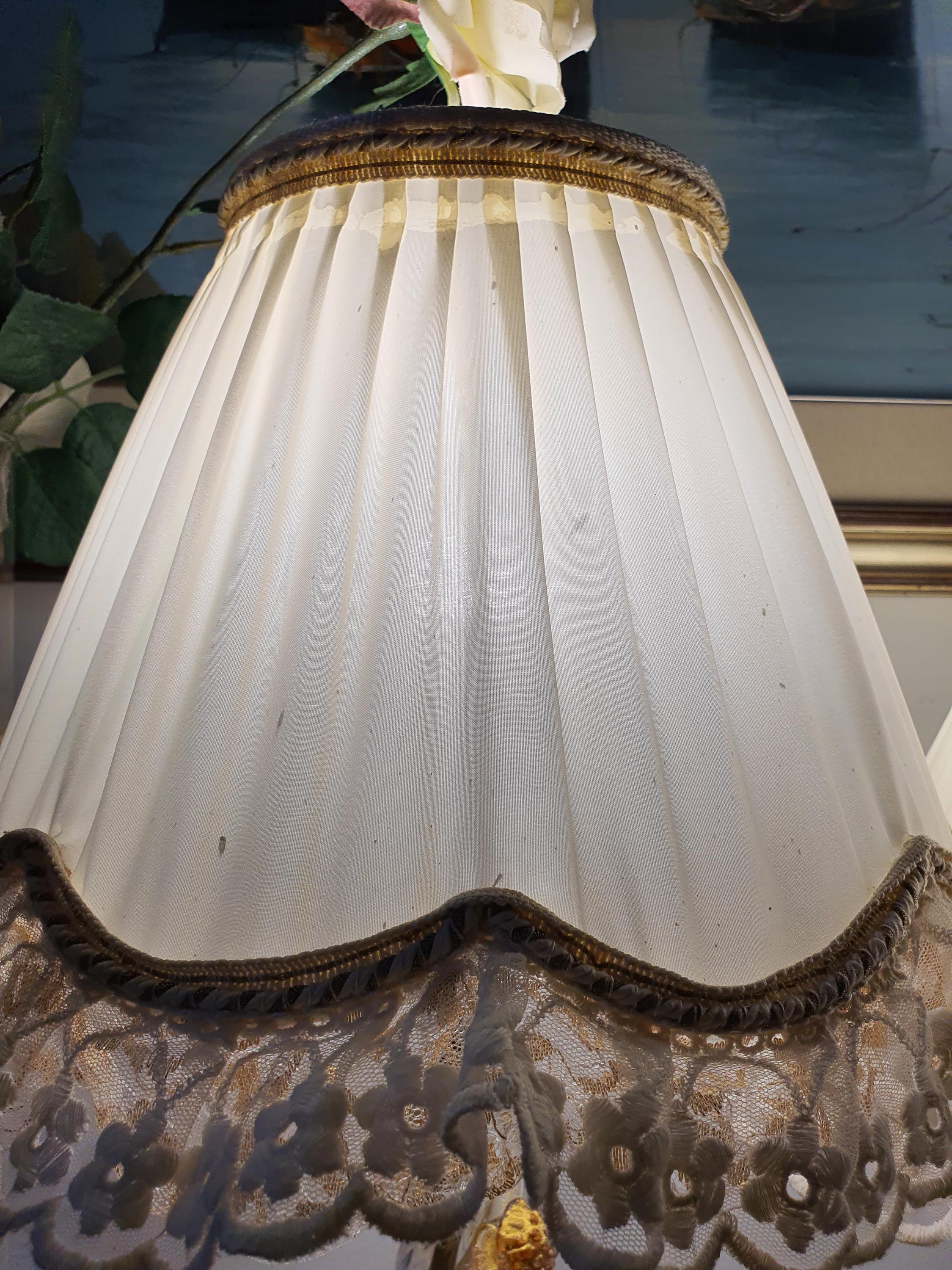 Pair of vintage Murano aventurine gold flake bedside lamps lit, warm gold shimmer through clear glass, pink grapes leaves, romantic interior