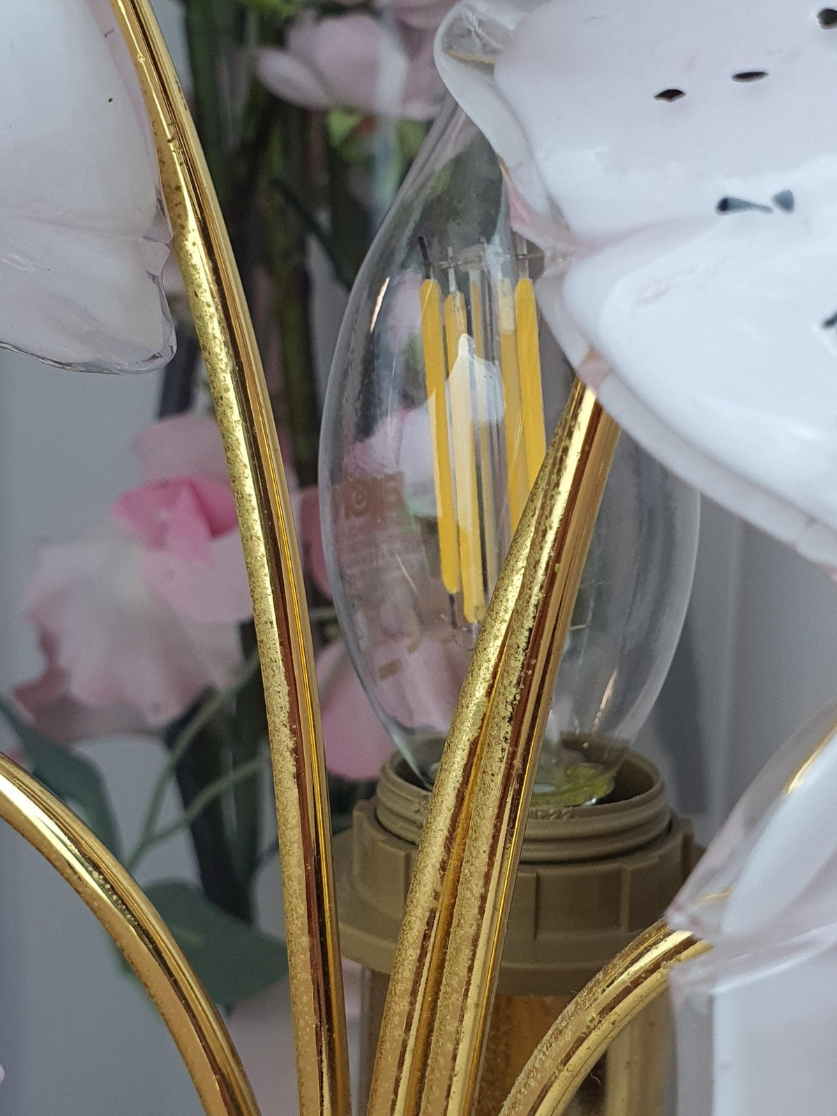 Dark speckles decorating the petals of handcrafted Murano glass flowers
