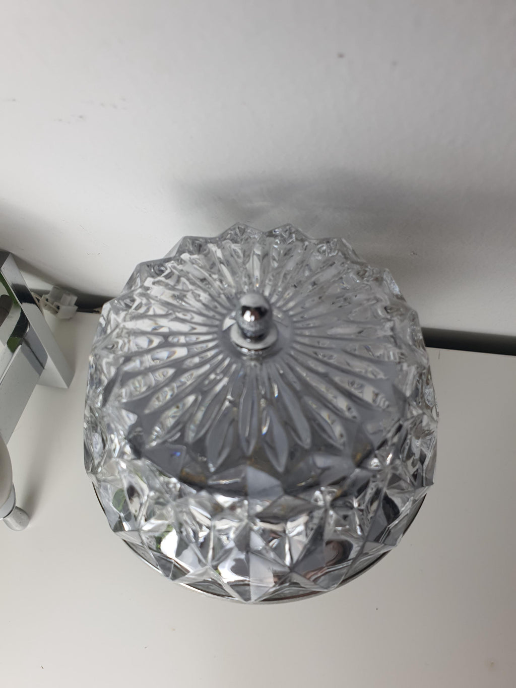 Brutalist vintage sconce — textured clear glass and silver metal contrast