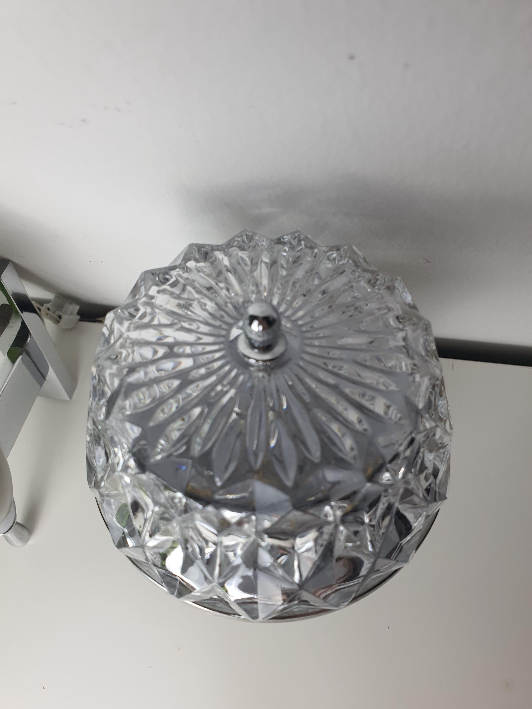 Brutalist vintage sconce — textured clear glass and silver metal contrast