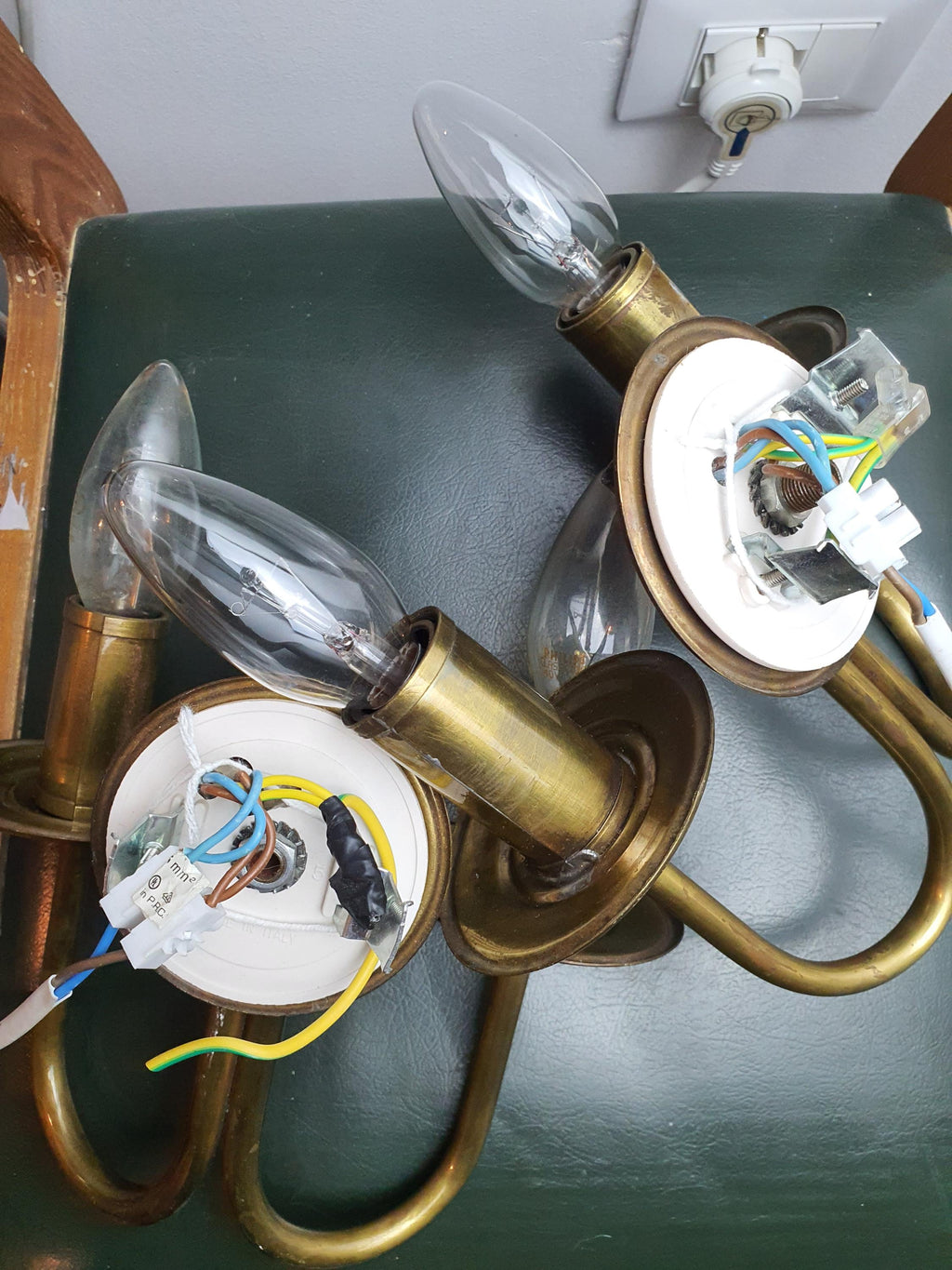 Pair of vintage Italian double-arm lacquered brass wall sconces in hallway, warm brass patina, Art Deco classical Italian