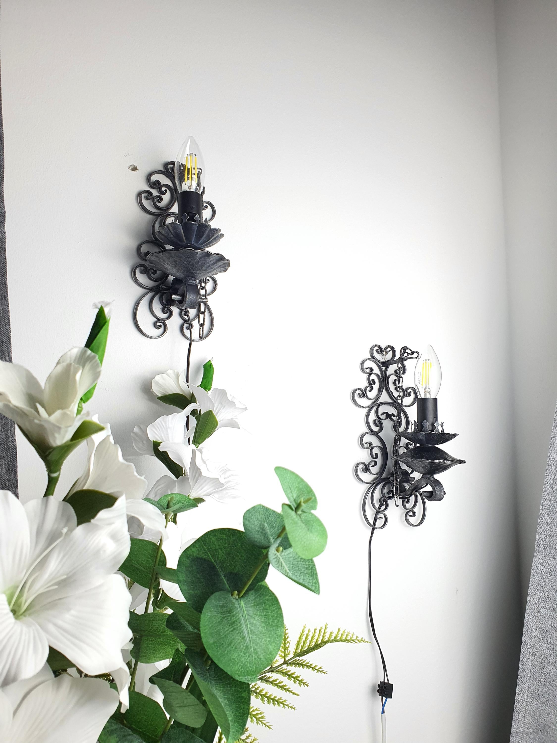 Pair of dark grey gothic wall lights — hallway or dining room setting