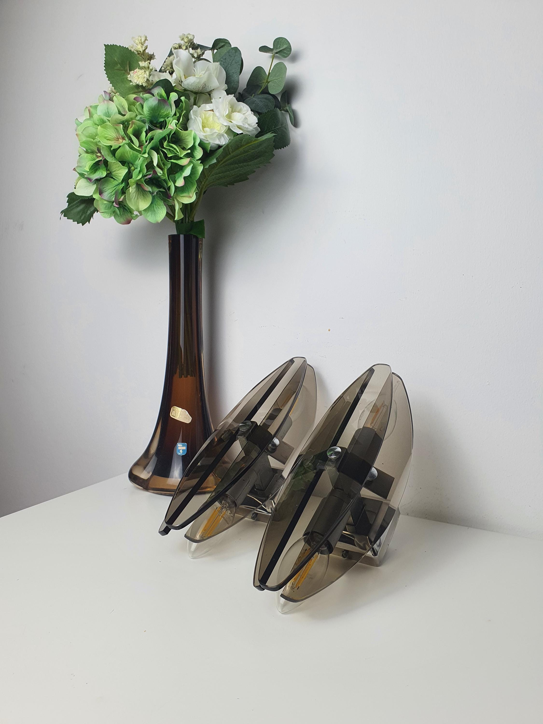 Vintage Veca Italian sconce — reflective chrome and dark glass interplay, close-up