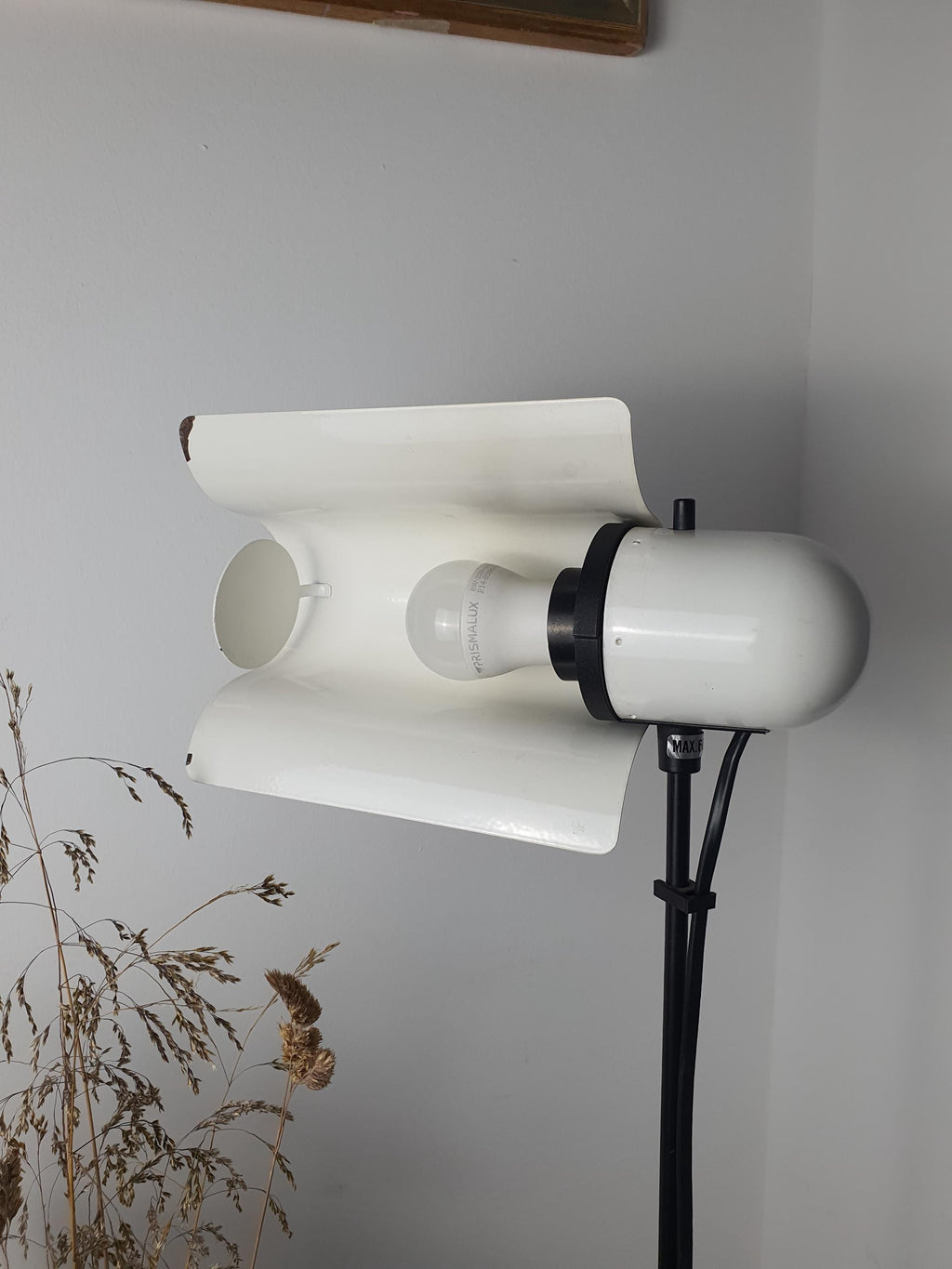 Vintage Italian white floor lamp unlit, showing swing visor silhouette, U-shaped arm, and telescopic stem