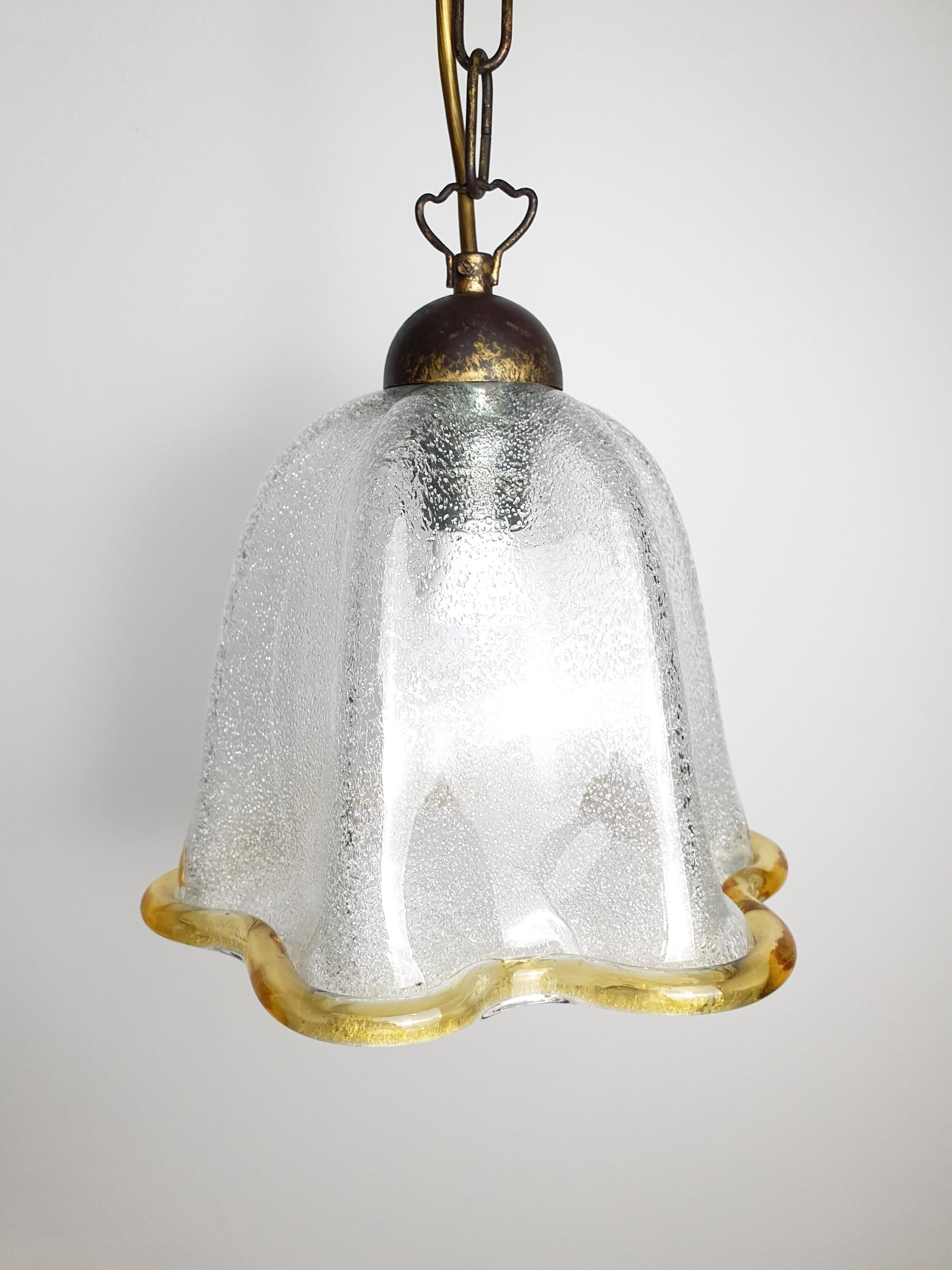 Vintage Murano graniglia bell tulip pendant in bedroom, bronze chain, warm accent light, Italian artisan MCM style