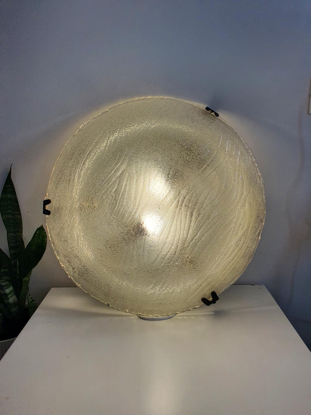 Large vintage Venetian shell flush mount lit, sparkling ribbed clear glass reflections, soft sand-iced diffusion, low ceiling setting