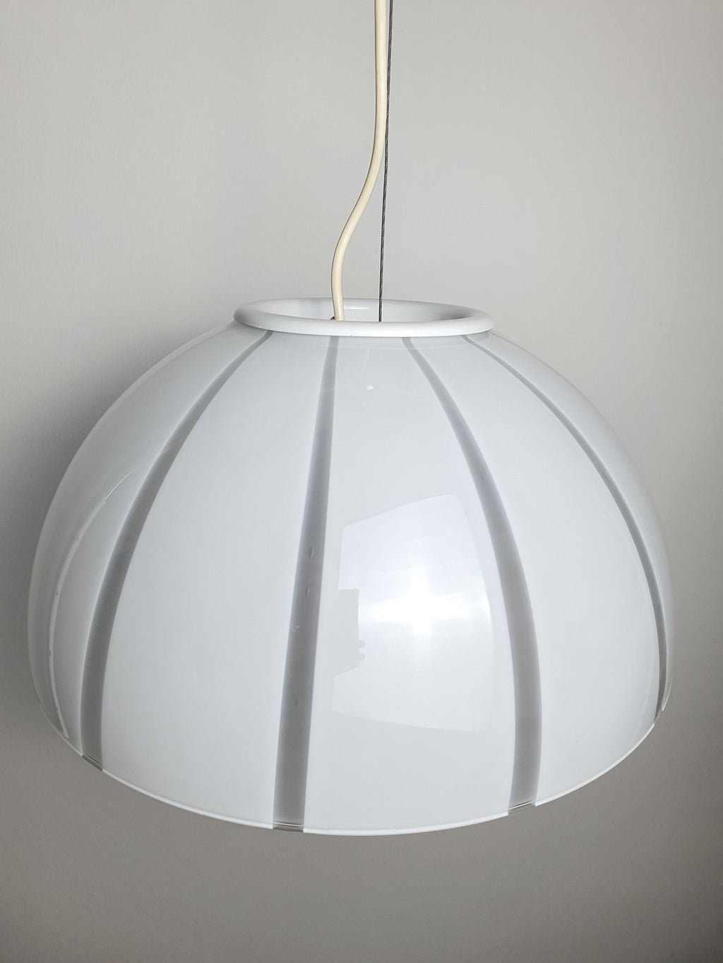 White and clear stripe detail on vintage Murano glass bell pendant, soft light diffusion, gold canopy, 1960s–1980s Italy

