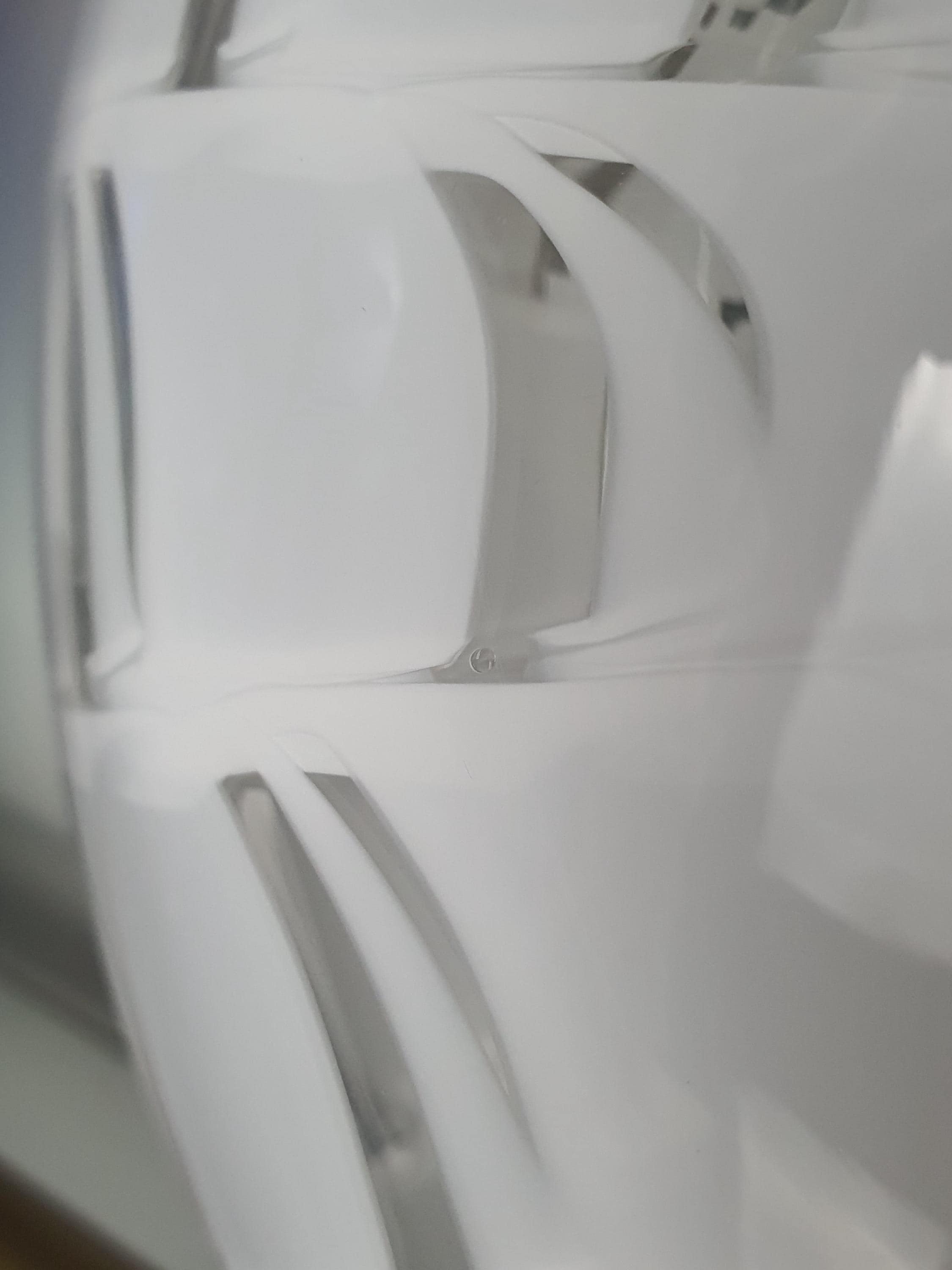 Close-up of white and clear spiderweb radiating pattern on vintage Murano glass starburst flush mount, intricate glass lines