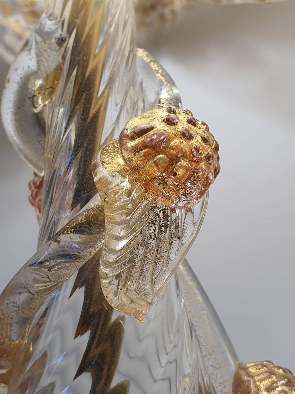 Gold-toned metal base with patina on vintage Murano aventurine gold flake bedside lamp, aged gold base and grapes glass detail