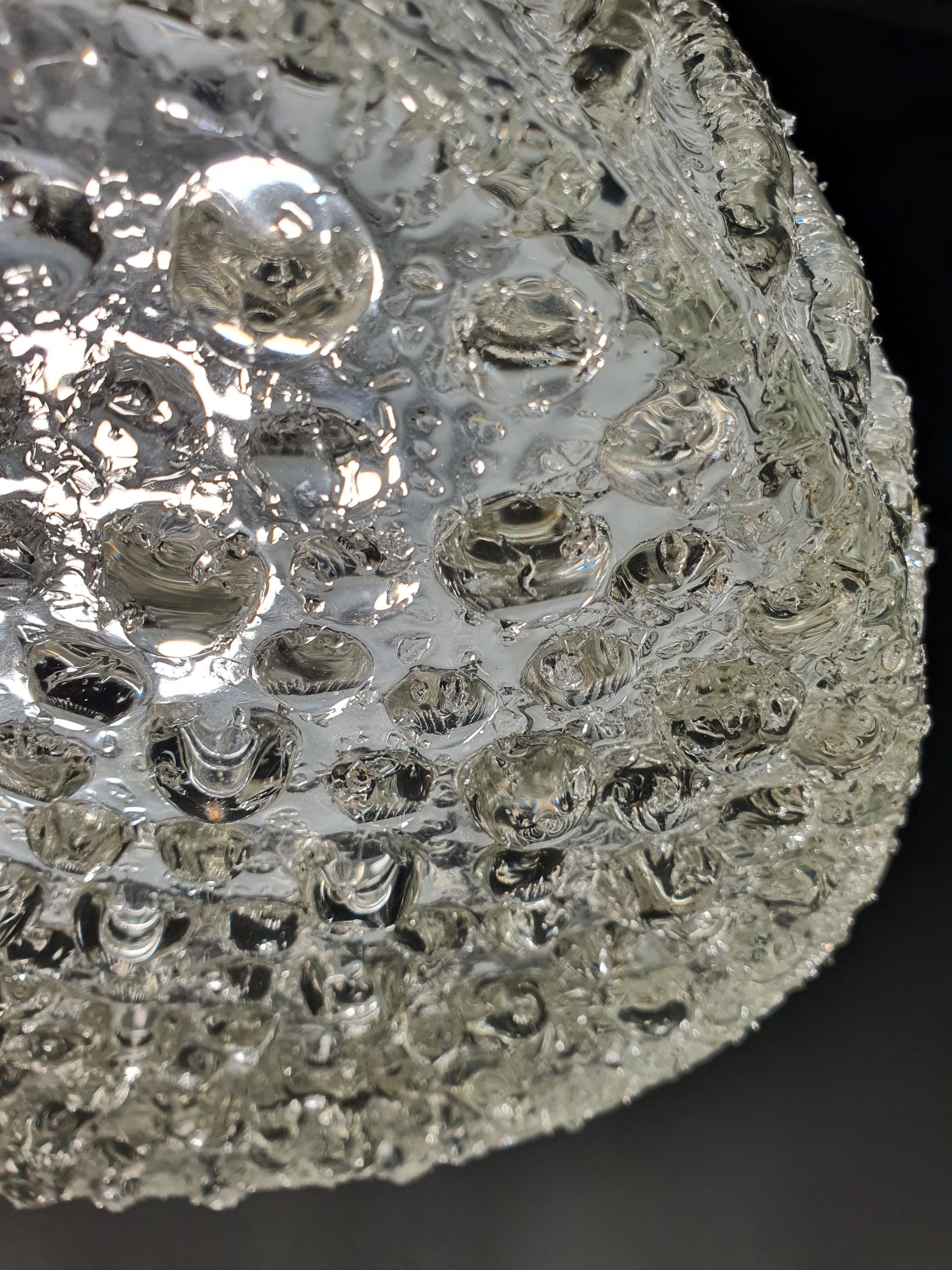 1970s Italian glass pendant — transparent and frosted glass texture, organic form close-up