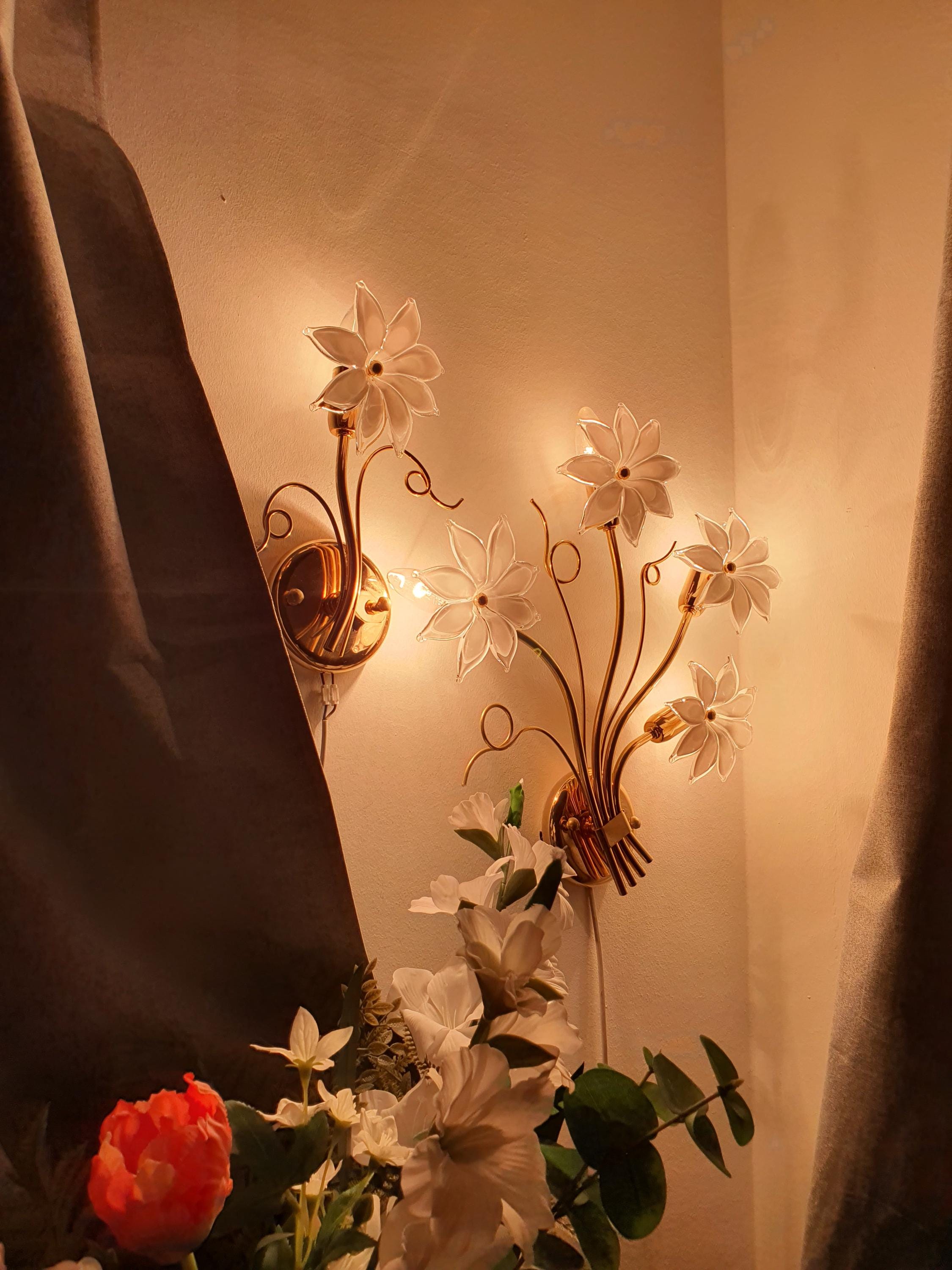 Asymmetrical pair of vintage Italian Murano glass floral sconces installed together, large 4-bloom and small 1-bloom, gold metal frames

