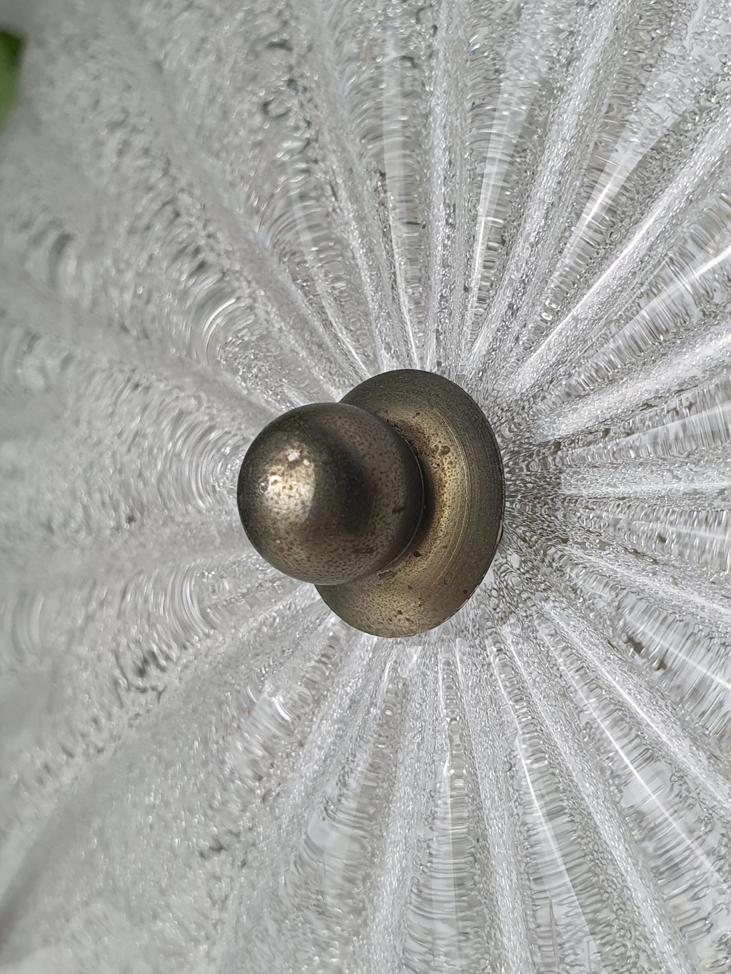 Close-up of thick ribbed clear glass and ghiacciato iced texture on vintage Murano shell flush mount, light reflections