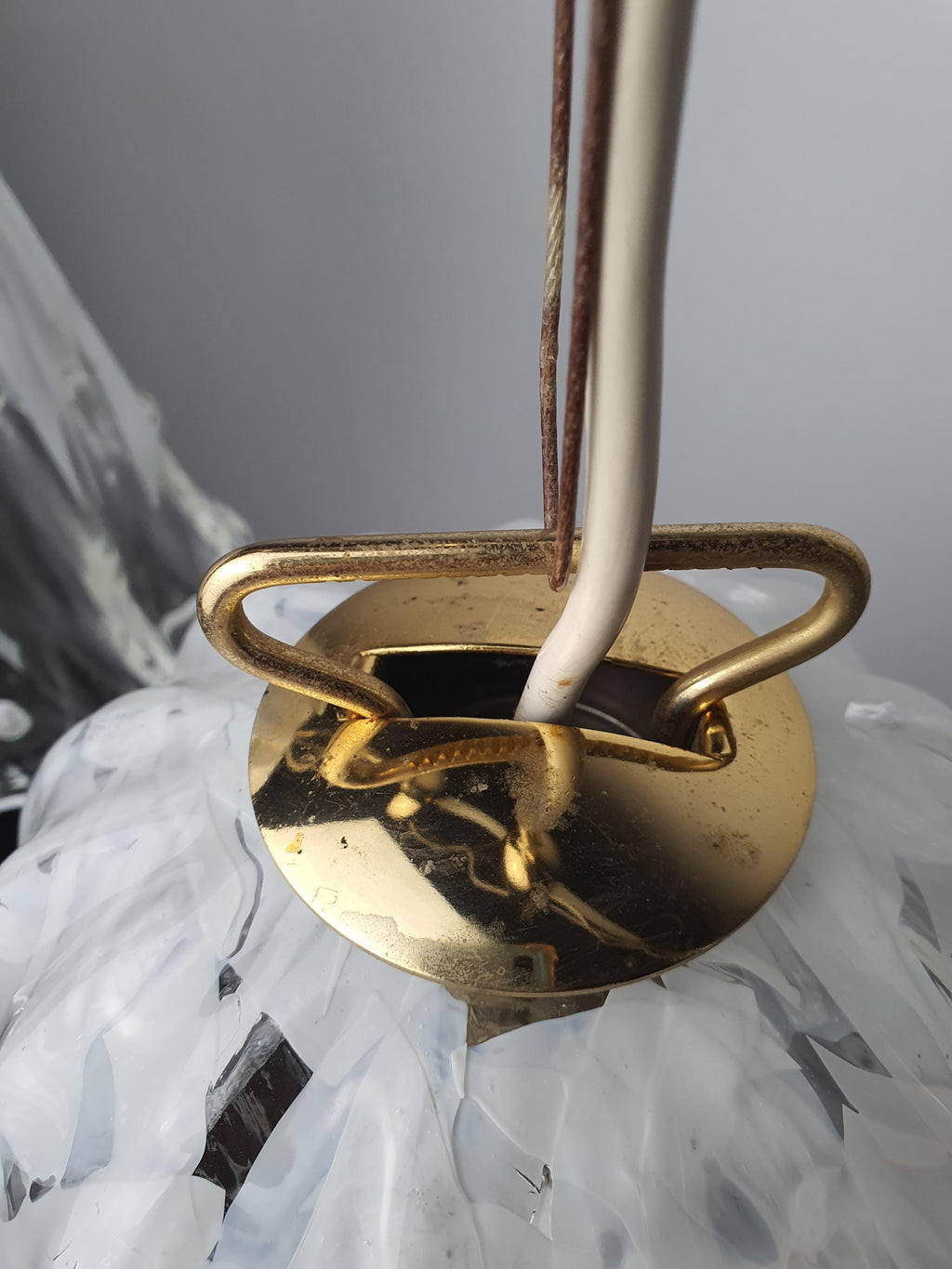 Metal fitting with age-related wear and patina on a vintage La Murrina pendant

