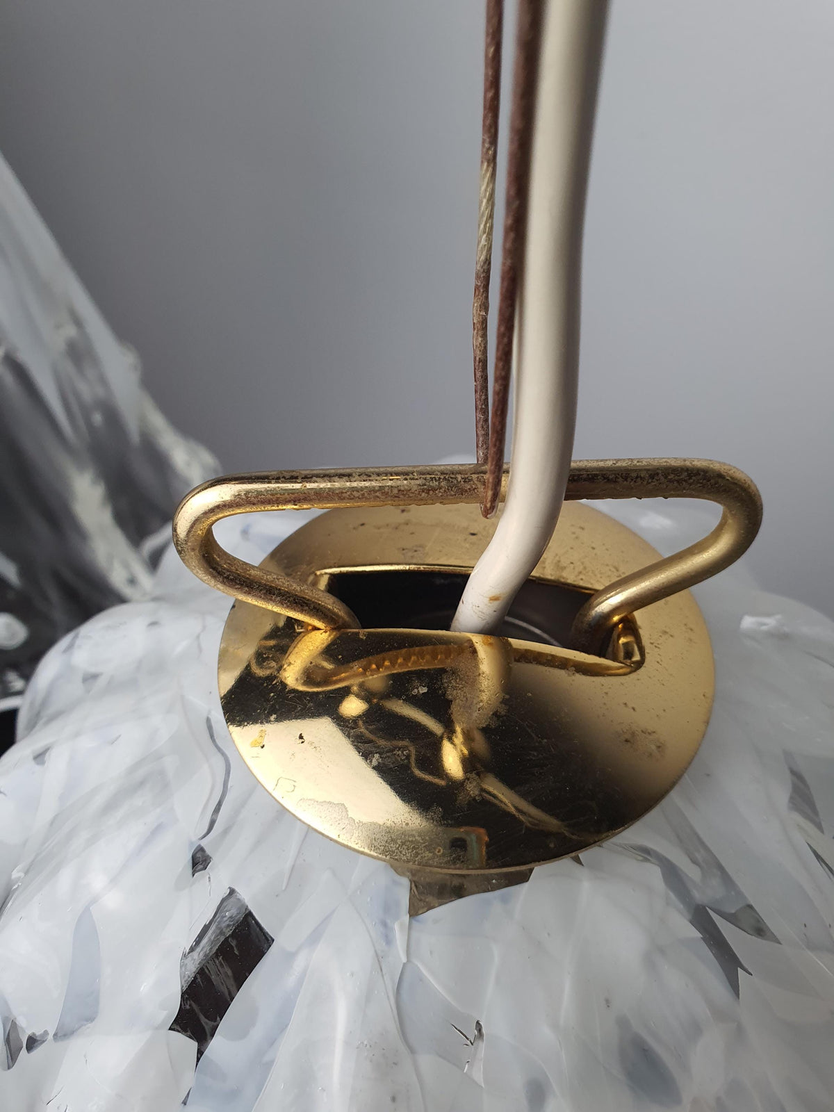 Metal fitting with age-related wear and patina on a vintage La Murrina pendant
