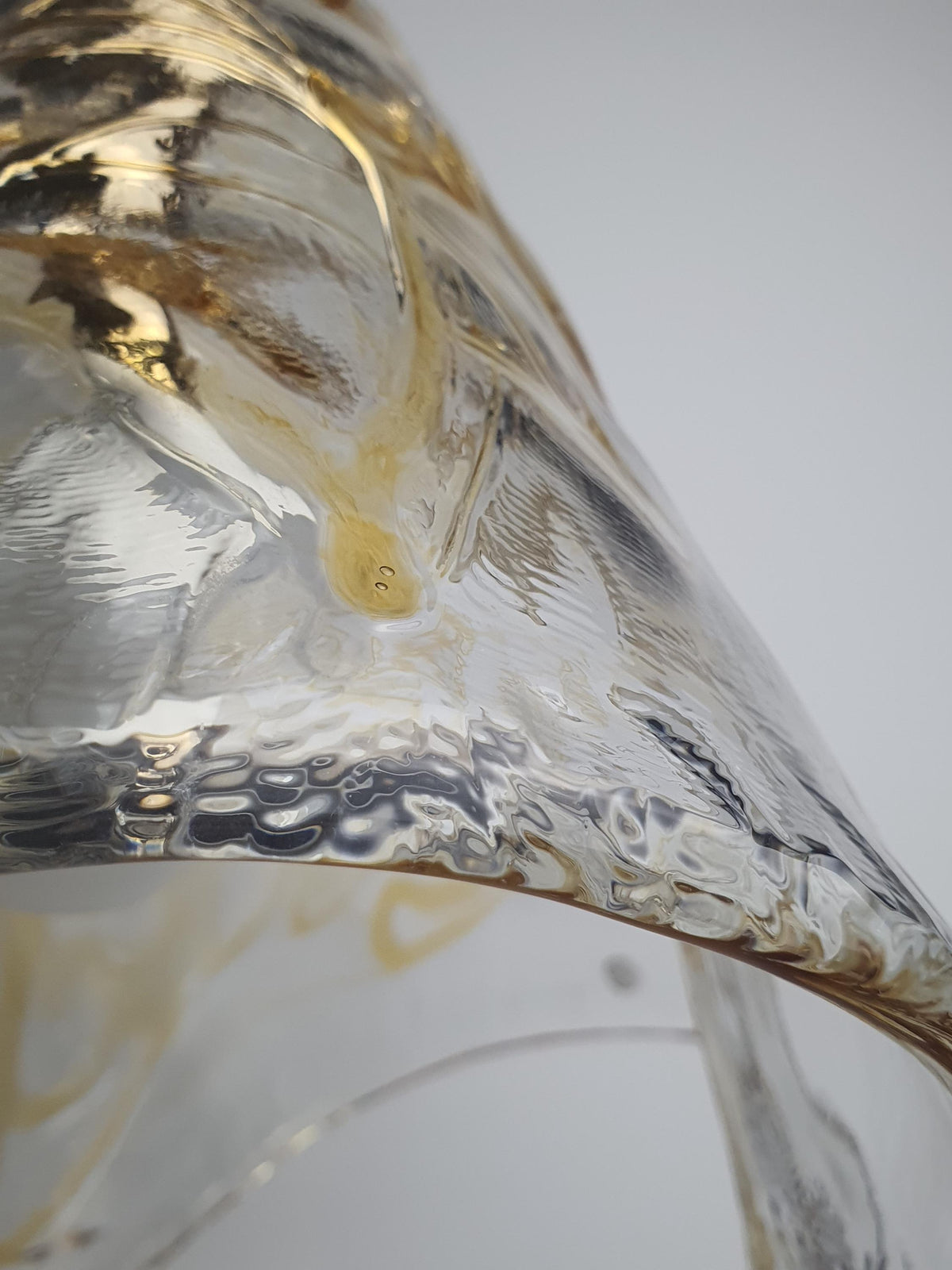 Honey-coloured glass droplets within a clear vintage Murano pendant shade

