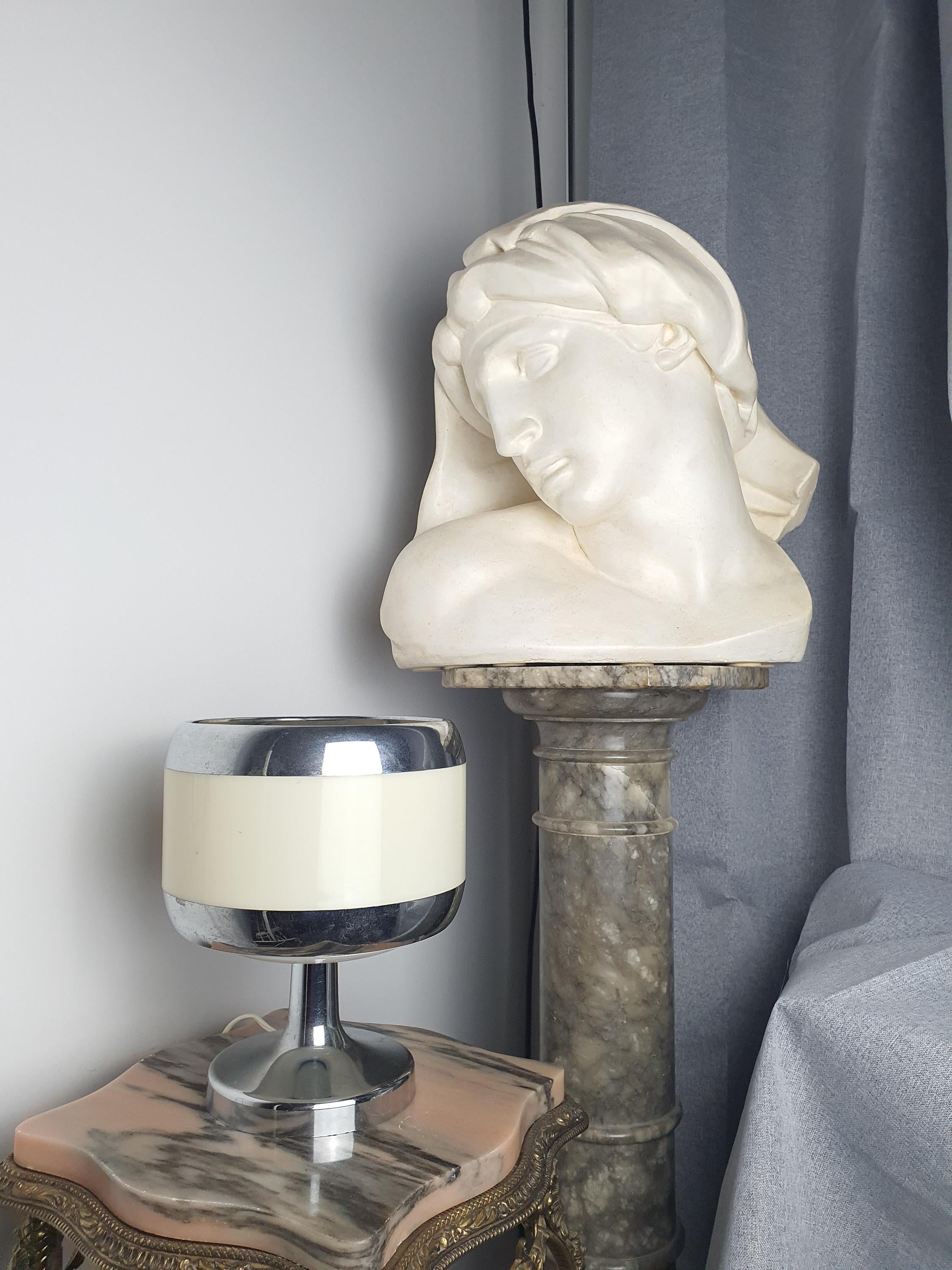 Vintage 1970s Italian Space Age table lamp on bedside table, soft opalescent glow, beige chrome, 1970s retro bedroom
