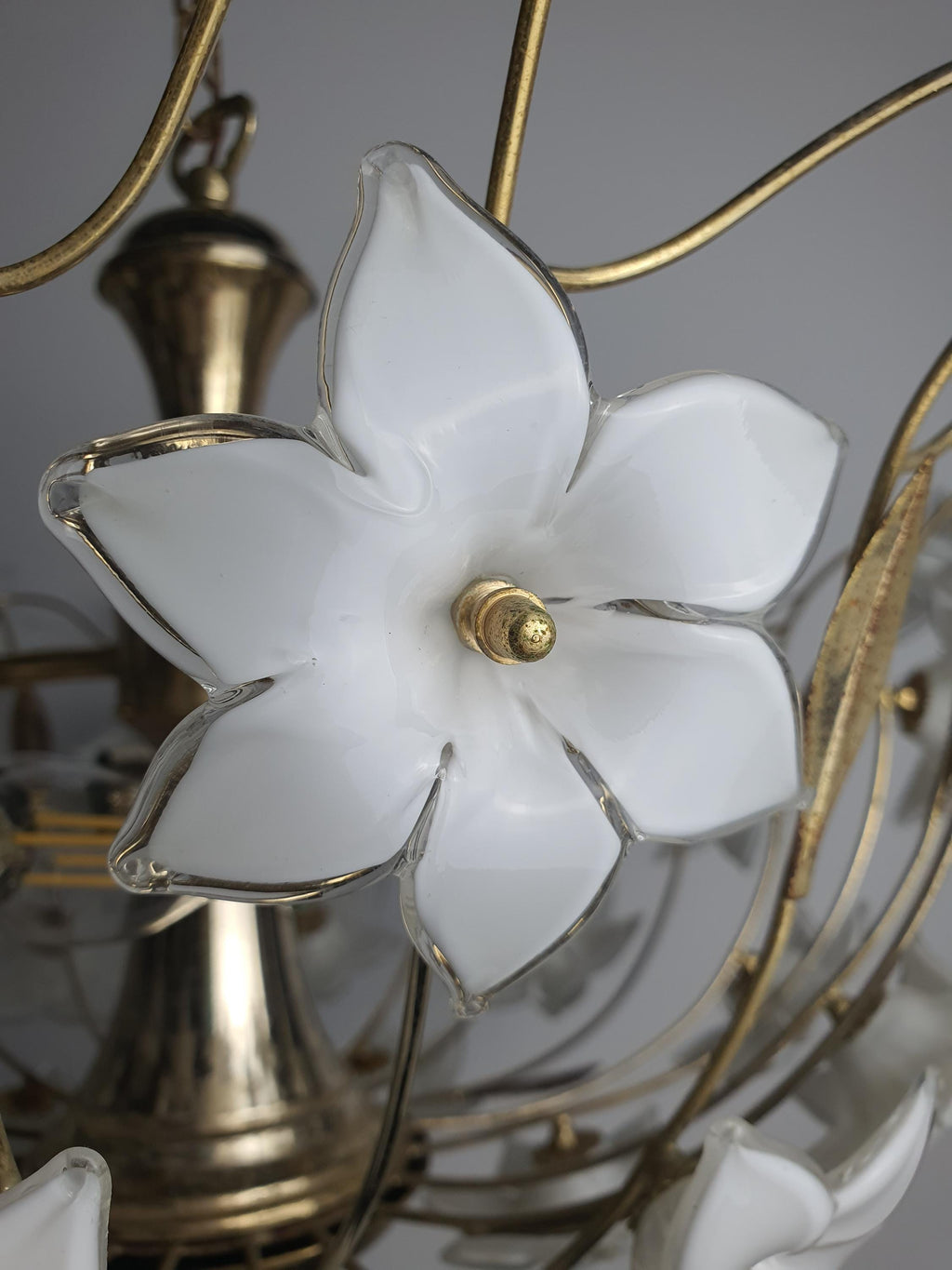 Close-up of white semi-translucent handcrafted Murano glass flowers on 1980s floral chandelier, Italian botanical craftsmanship