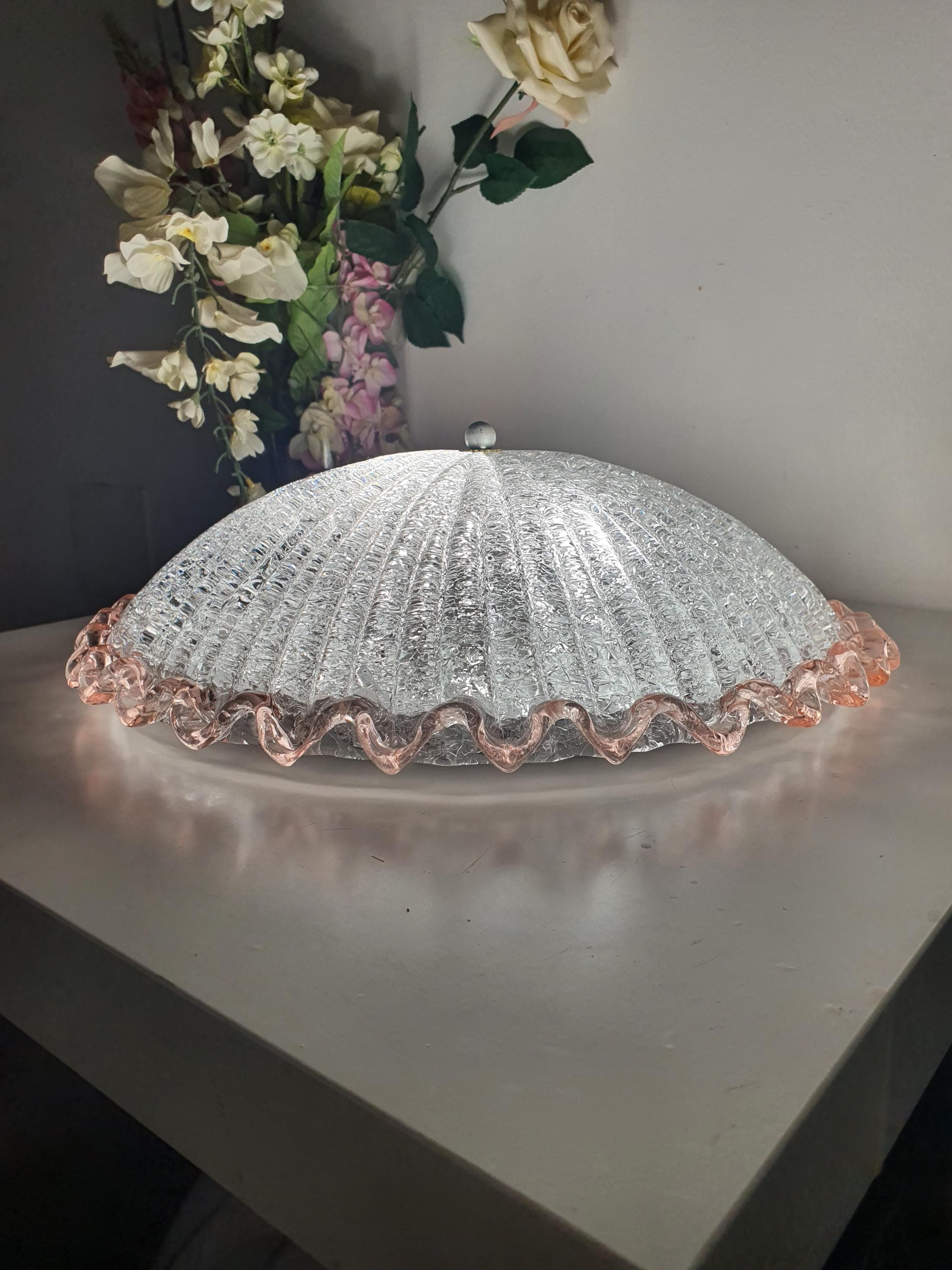 Vintage Murano floral flush mount in nursery, soft frosted glow, pink rim, feminine organic Italian lighting