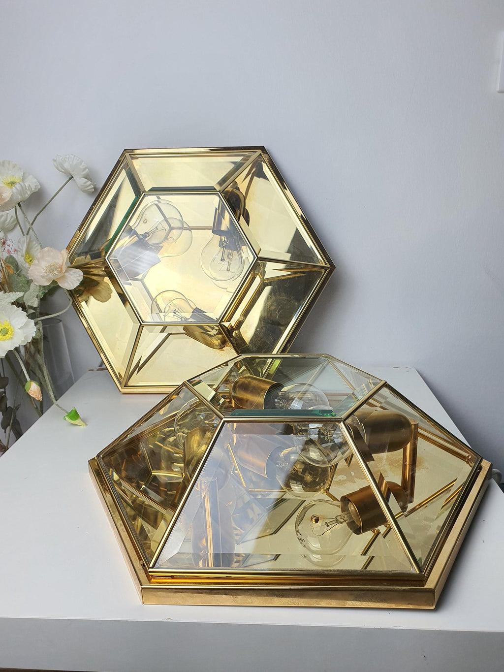 Pair of vintage Italian hexagonal mirror lights installed as ceiling fixtures, bright reflective glow, glamorous dining room