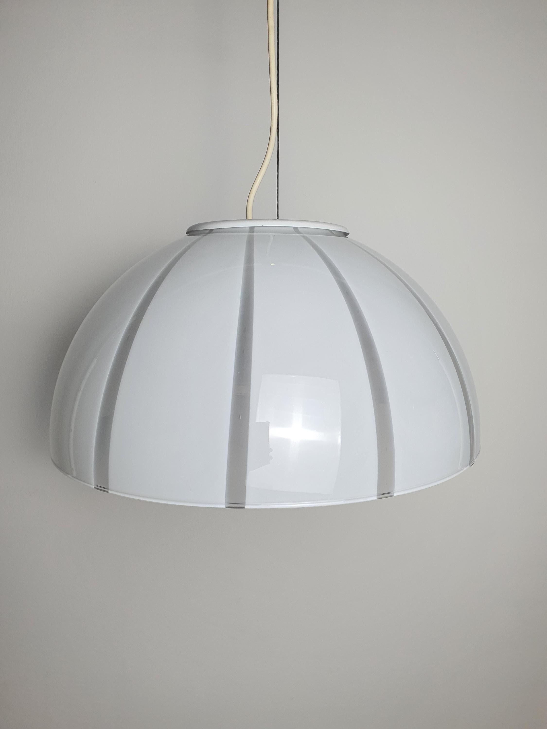 Vintage Murano bell pendant above dining table, 39cm wide, soft striped glass glow, Scandinavian MCM interior