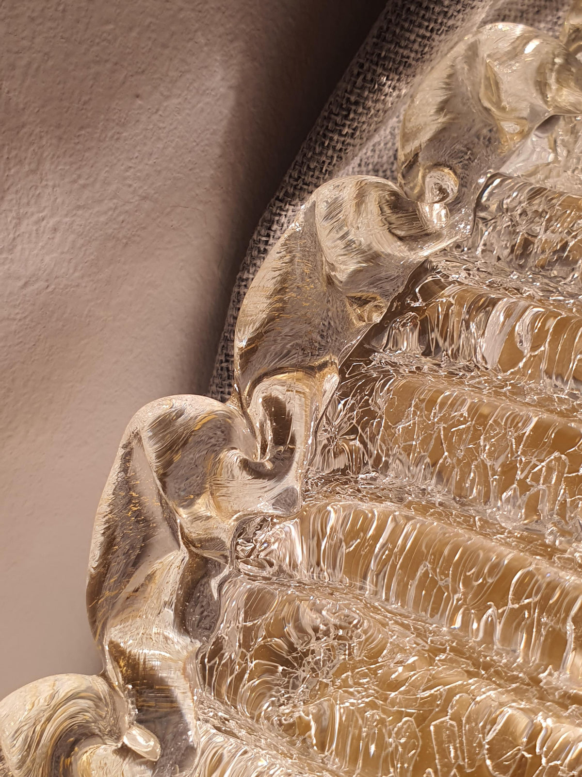 Thick clear glass with frosted texture and golden edge detailing
