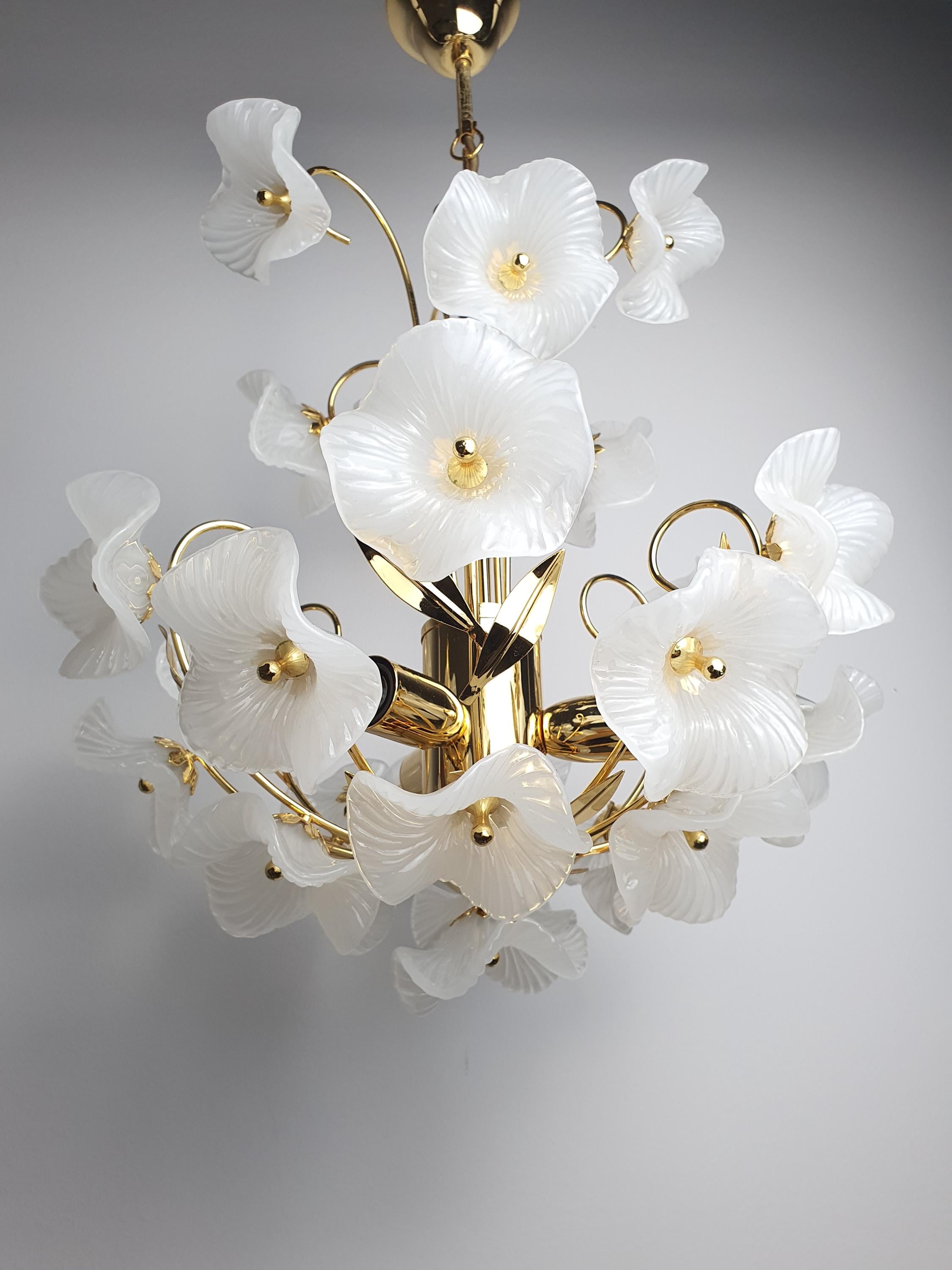 Vintage Murano white flower bouquet chandelier in dressing room, soft white bouquet glow, gold frame, intimate glamorous
