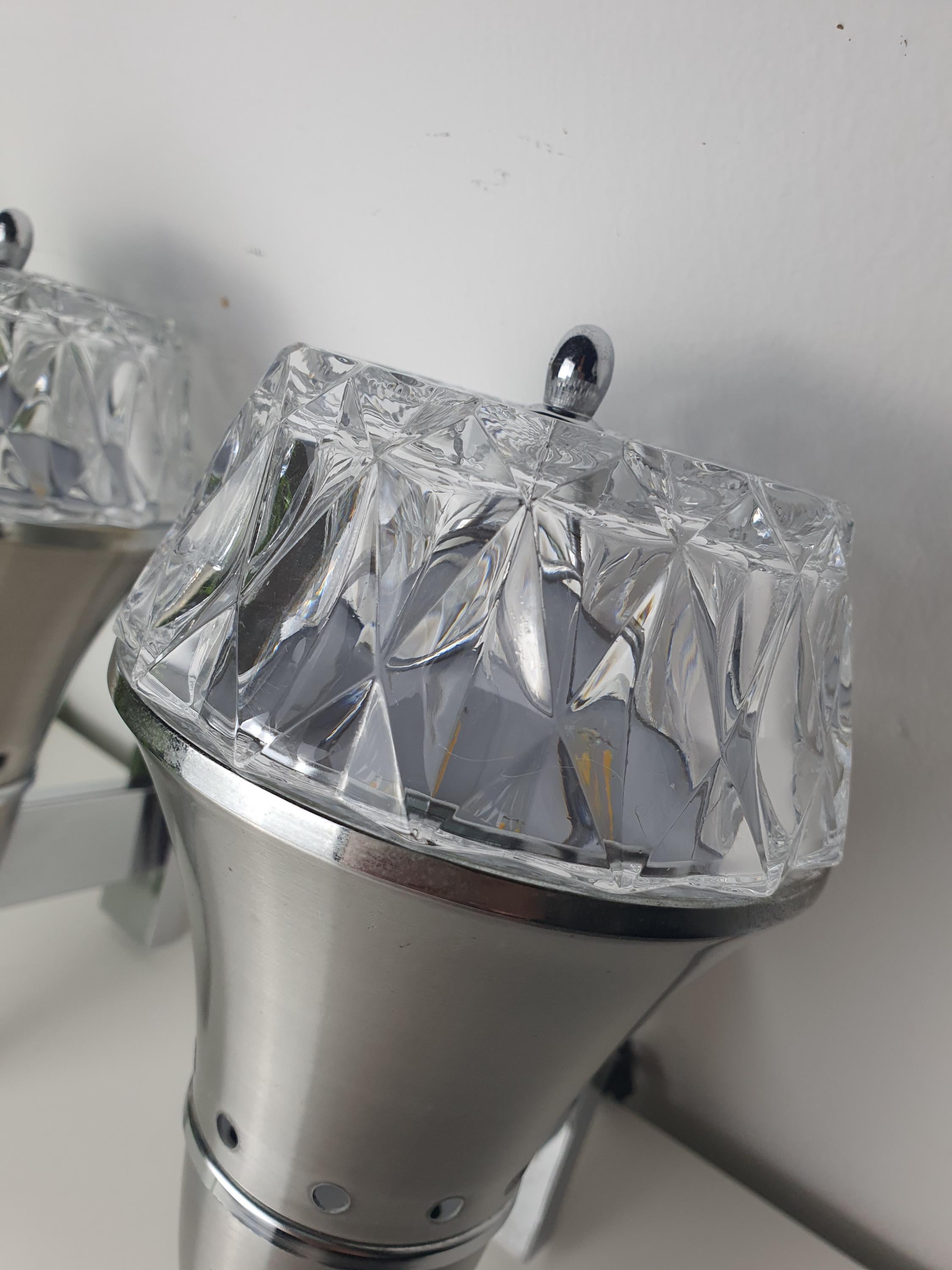 Brutalist Space Age wall sconce — silver-toned metal structure and chrome detail