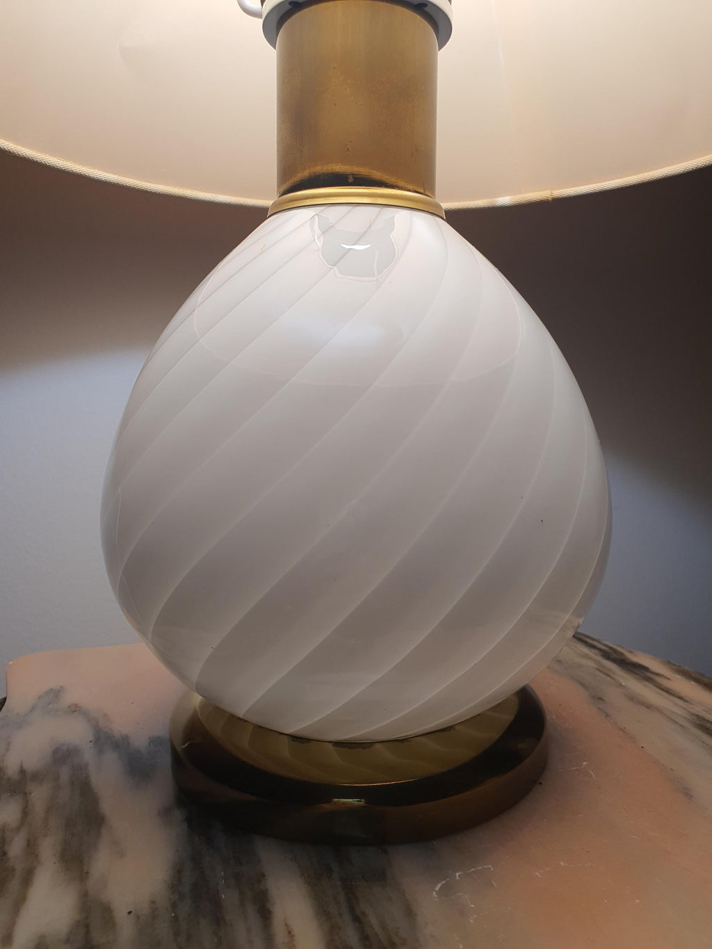 Vintage Murano white candy swirl bedside lamp in nursery, soft warm white swirl glow, beige shade, cottagecore interior