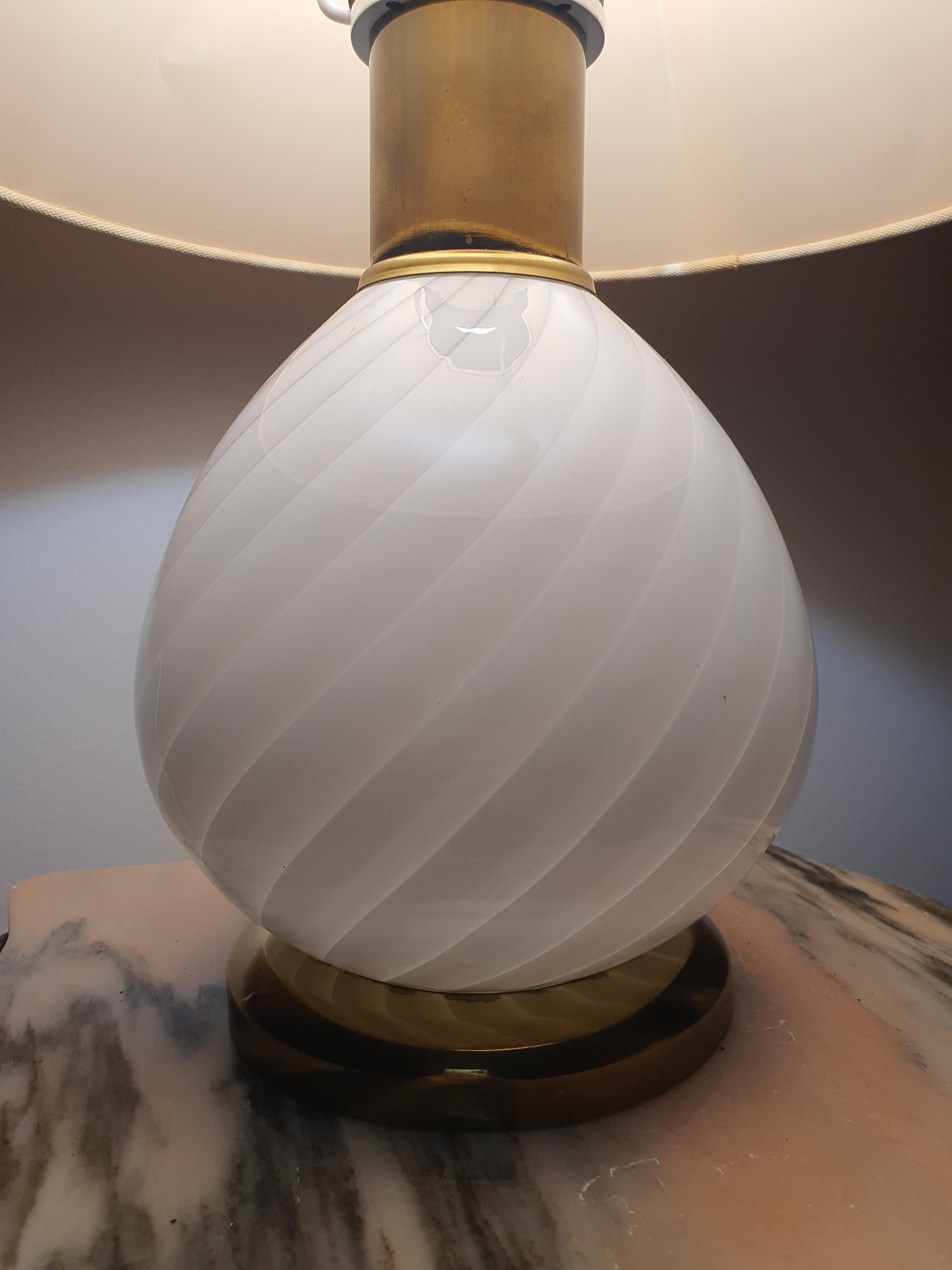 Vintage Murano white candy swirl bedside lamp in nursery, soft warm white swirl glow, beige shade, cottagecore interior