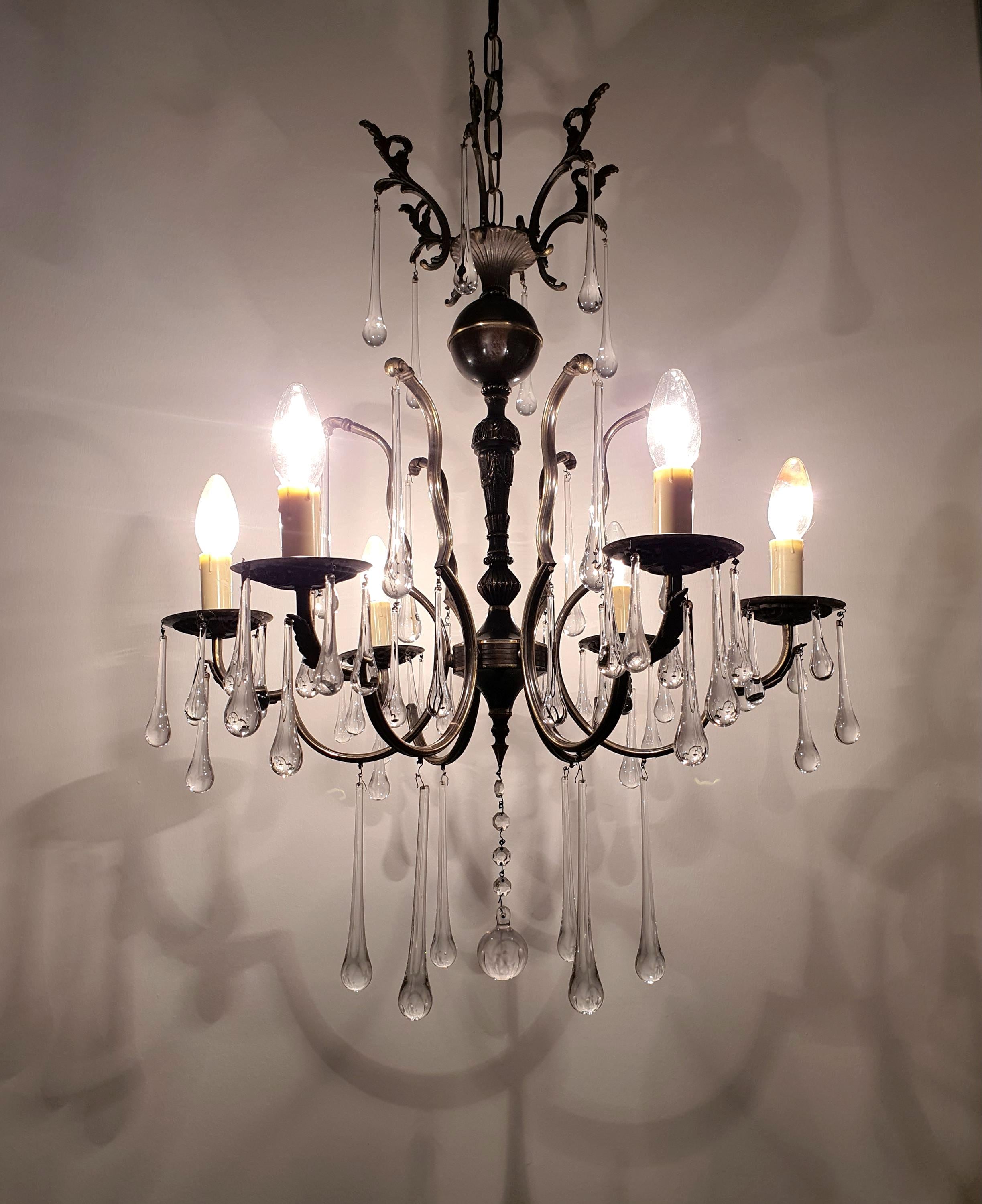 Vintage Italian brass 6-arm chandelier with cascading clear Murano glass teardrop pendants, Hollywood Regency Imperial, 1960s–1980s