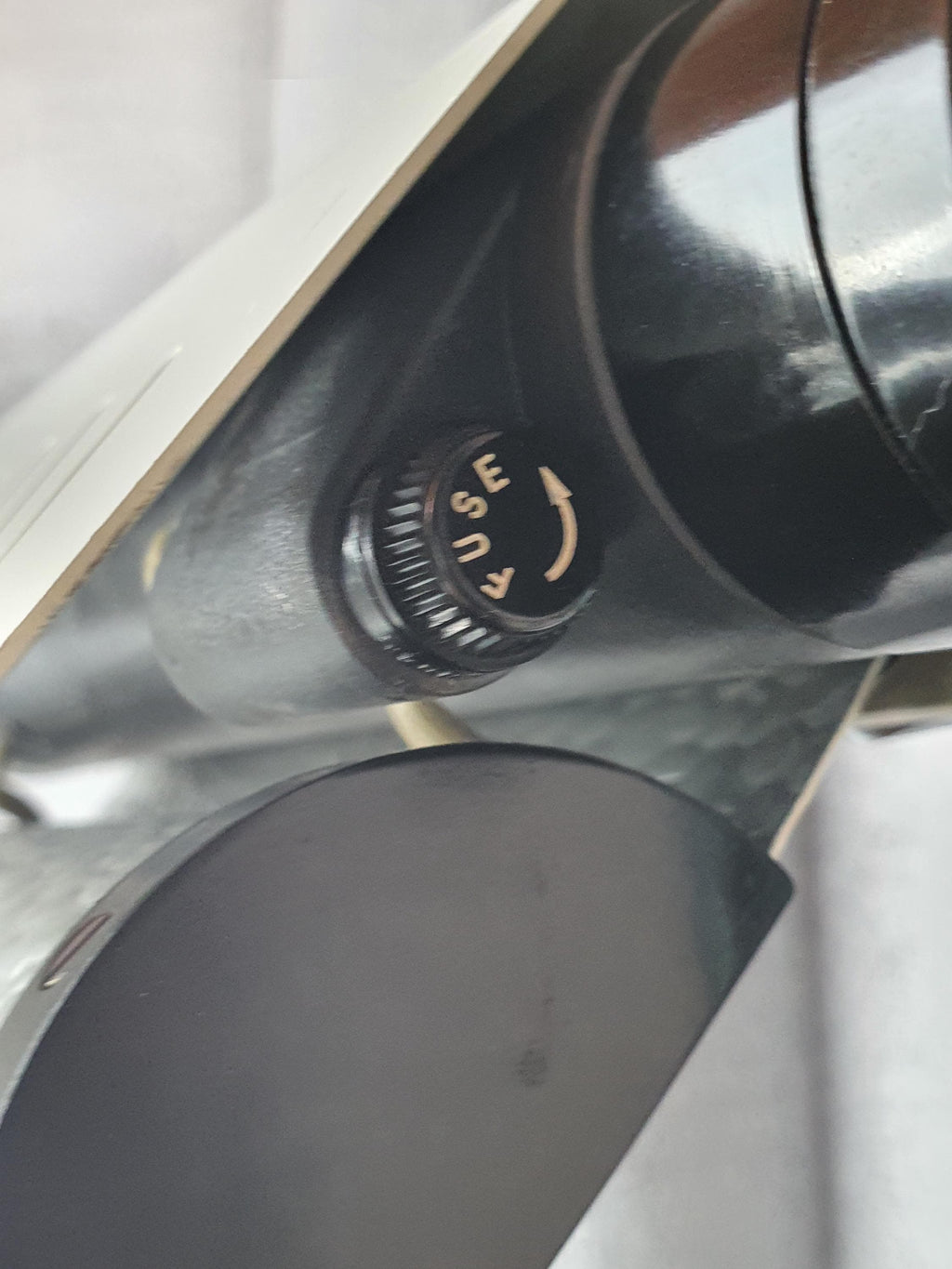 Close-up of white enamelled aluminium visor reflector, Joe Colombo Model 626 for Oluce, adjustable sliding mechanism