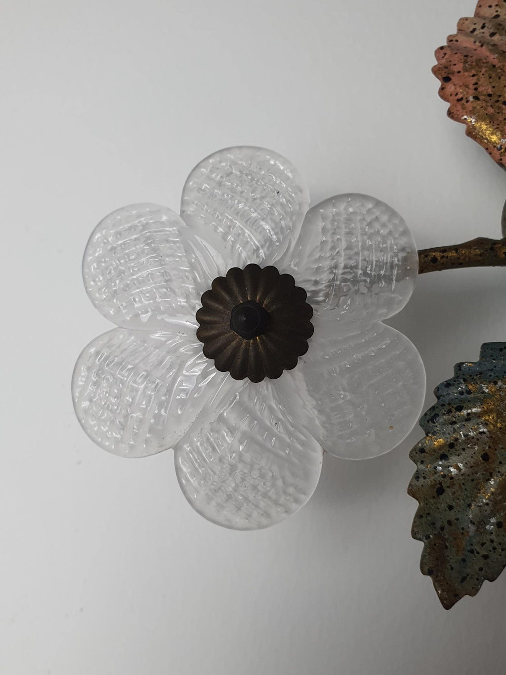 Close-up of calla lily-shaped Murano glass shades on vintage Italian toleware floral sconce, translucent petals and gold metalwork