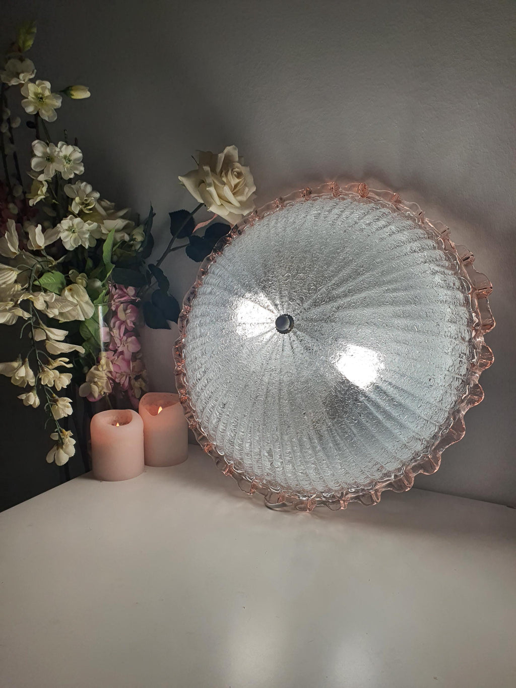 Vintage Murano floral flush mount unlit, showing frosted shell silhouette, pink rim and smooth exterior contrast

