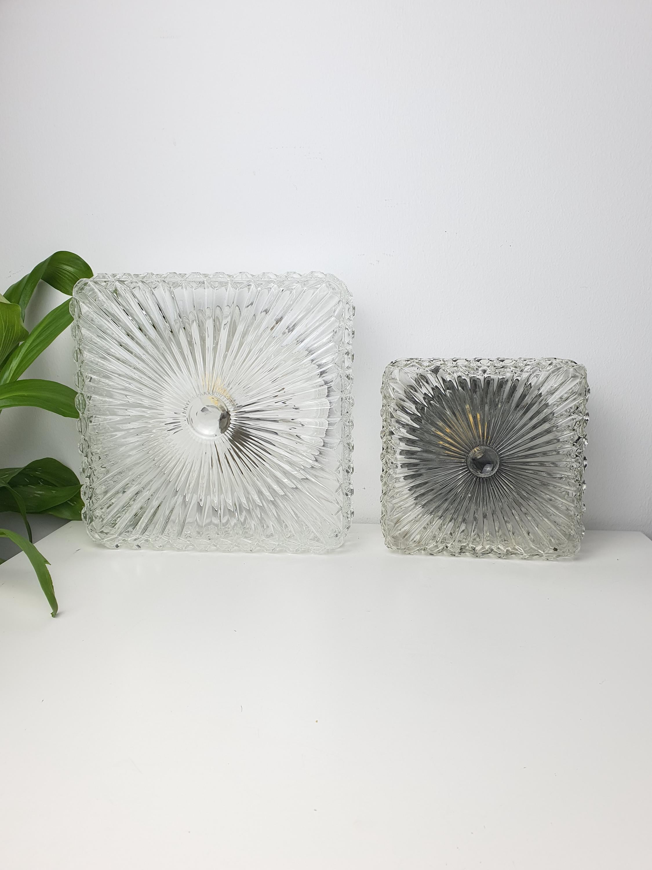 Set of 2 Brutalist MCM Midcentury wall sconces in stamped clear glass