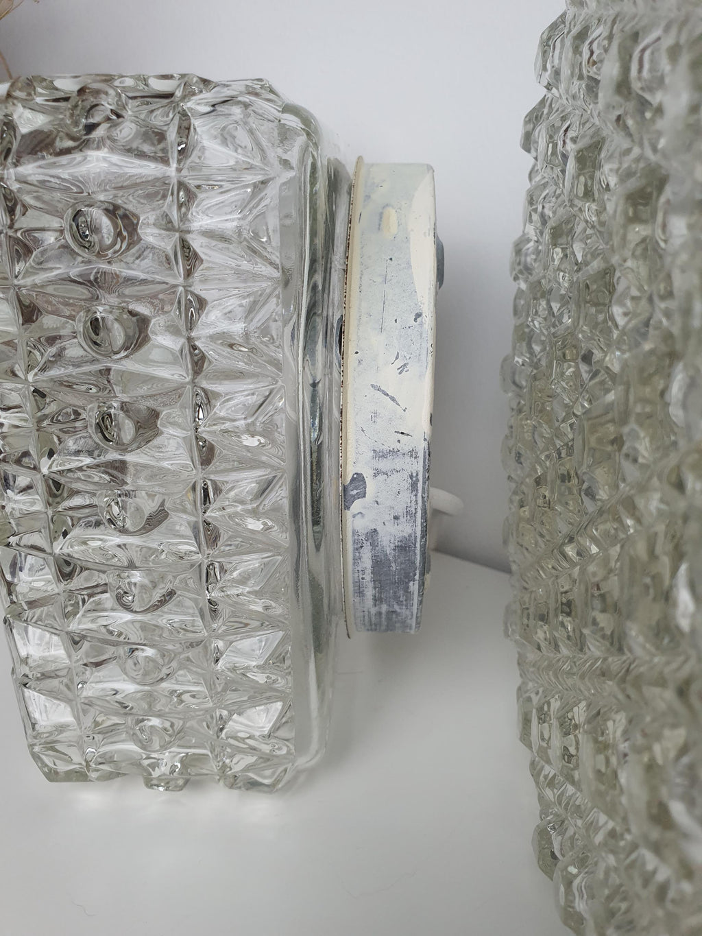 Square vintage wall light with pronounced geometric glass relief
