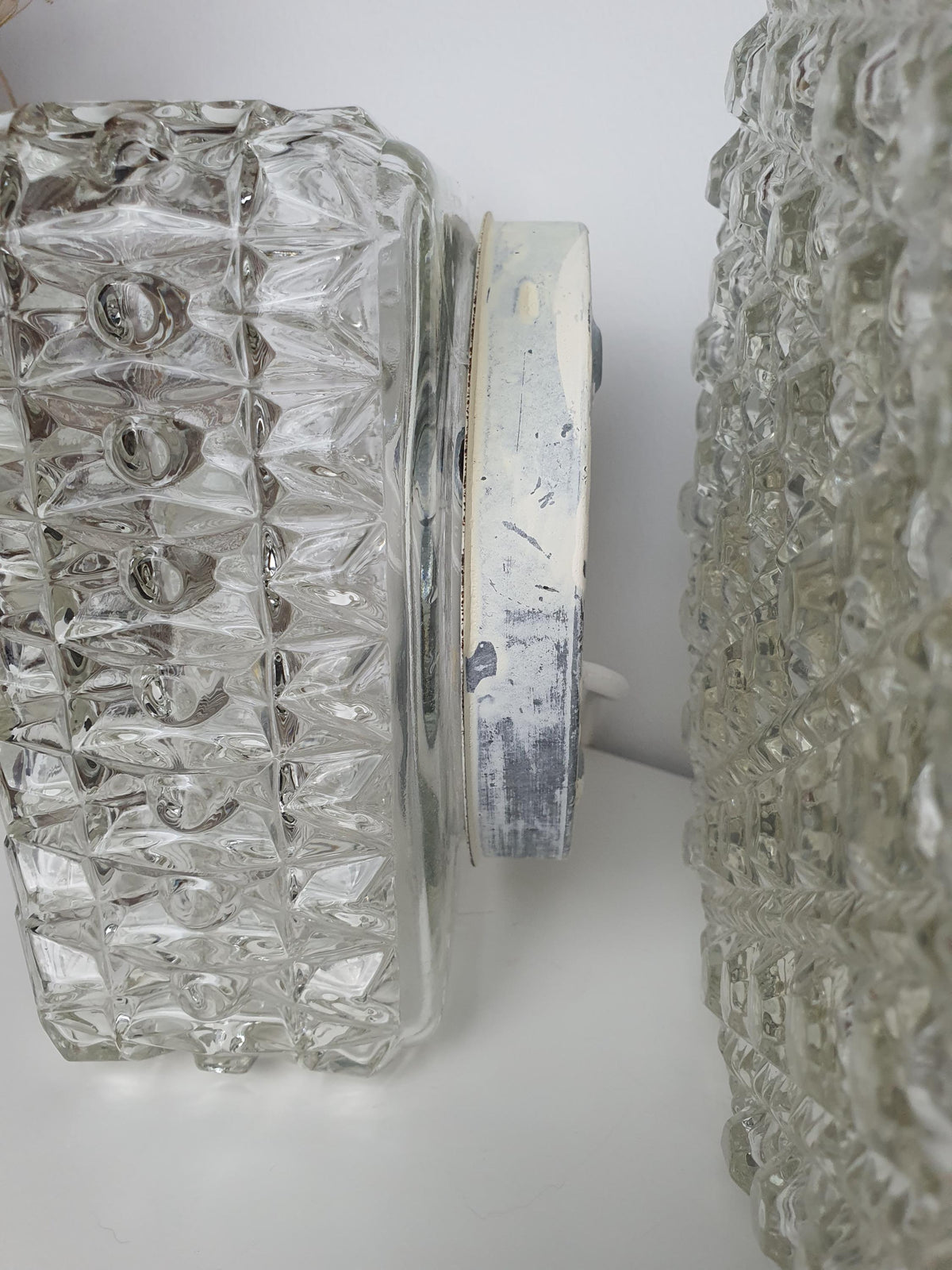 Square vintage wall light with pronounced geometric glass relief
