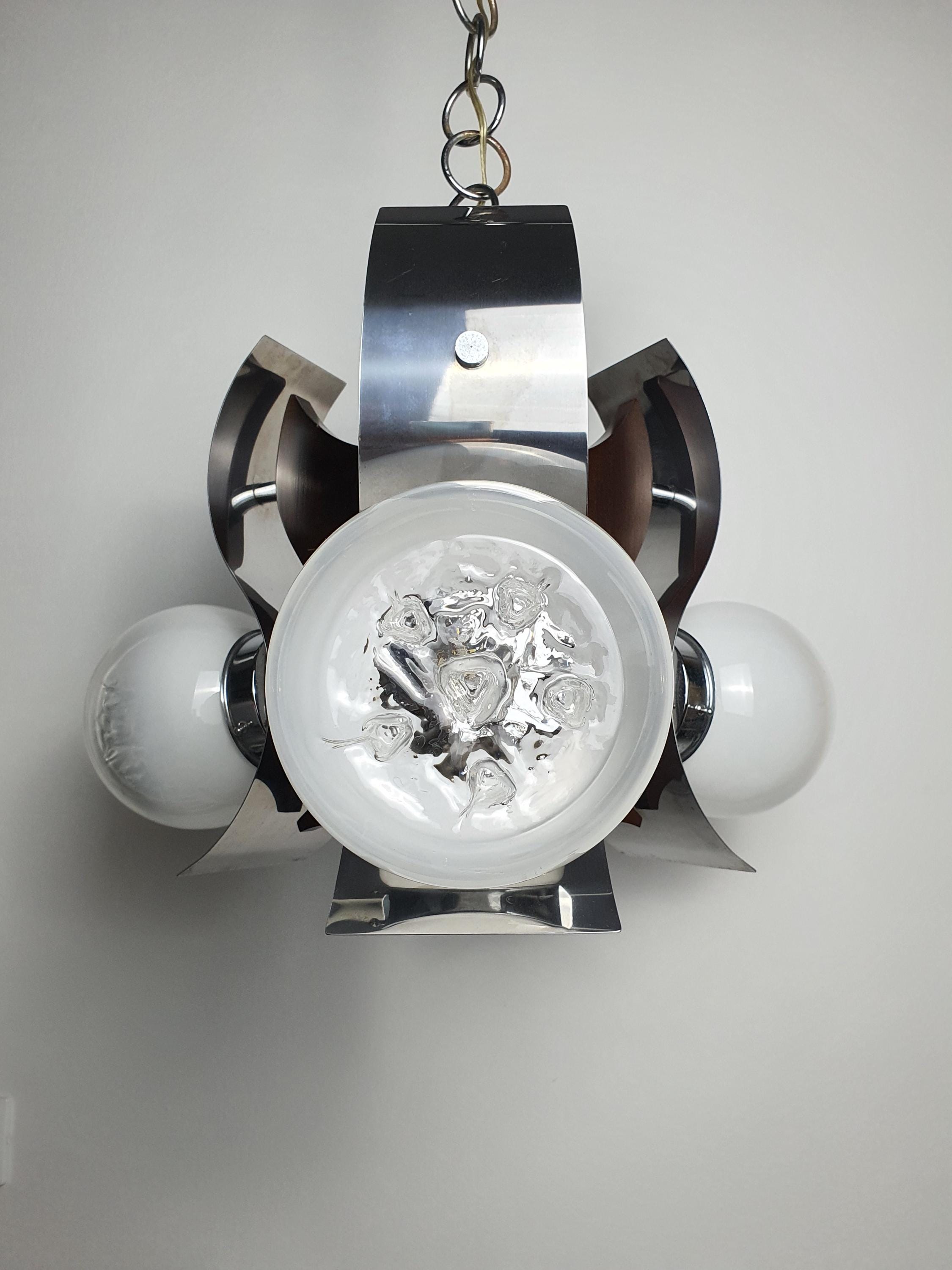 Vintage Murano 3-globe chandelier lit, warm gradient glow through white-to-clear glass globes, dining room setting