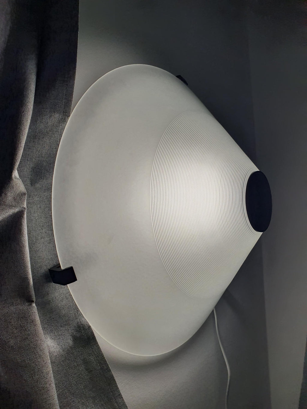Memphis style Italian light fixture — geometric pyramid form, side profile